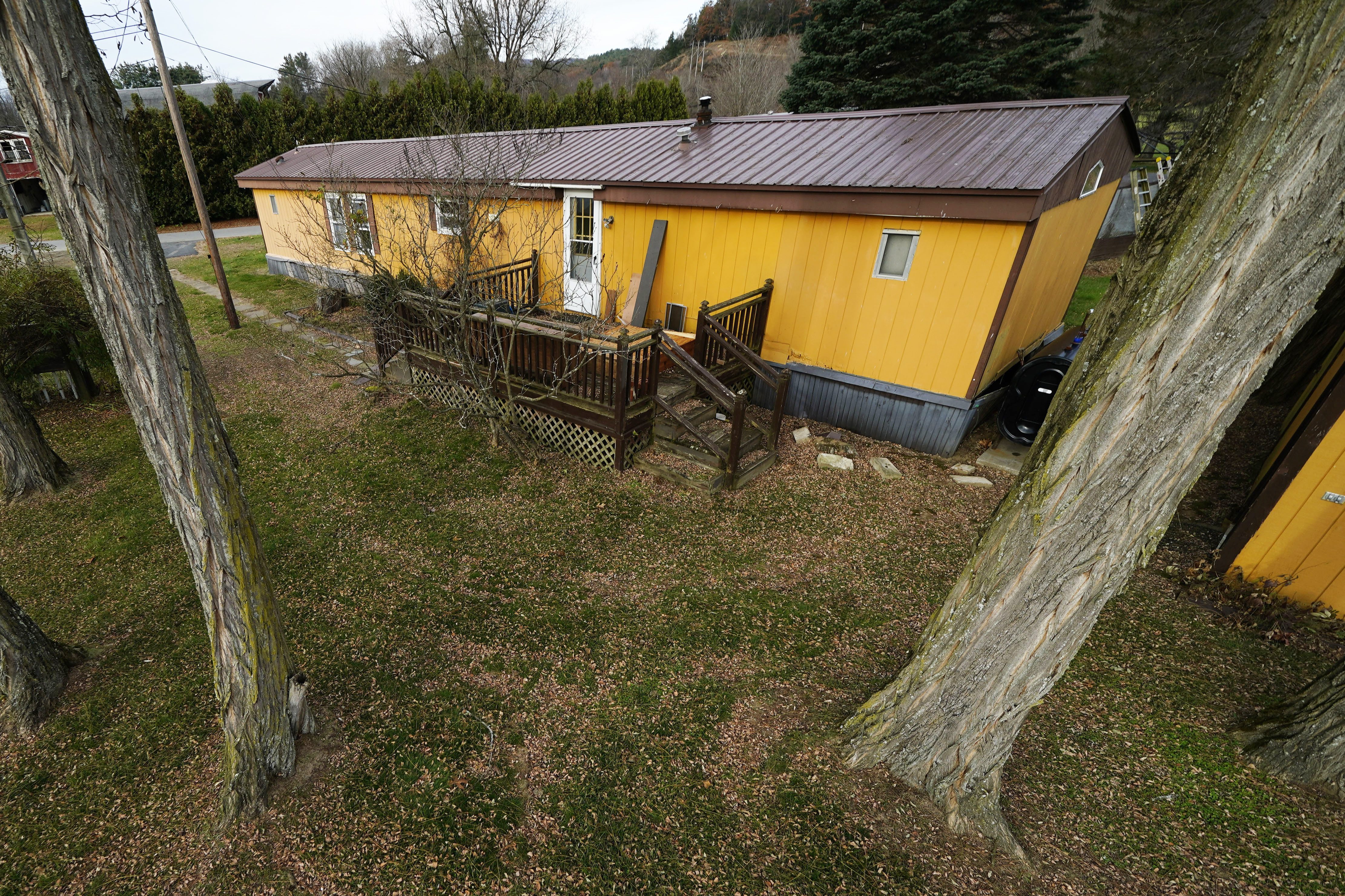 Starting in the 1950s, mobile homes became more permanent fixtures, with owners building out additions such as porches, fences and walkways.<br />(Robert F. Bukaty / AP Photo)
