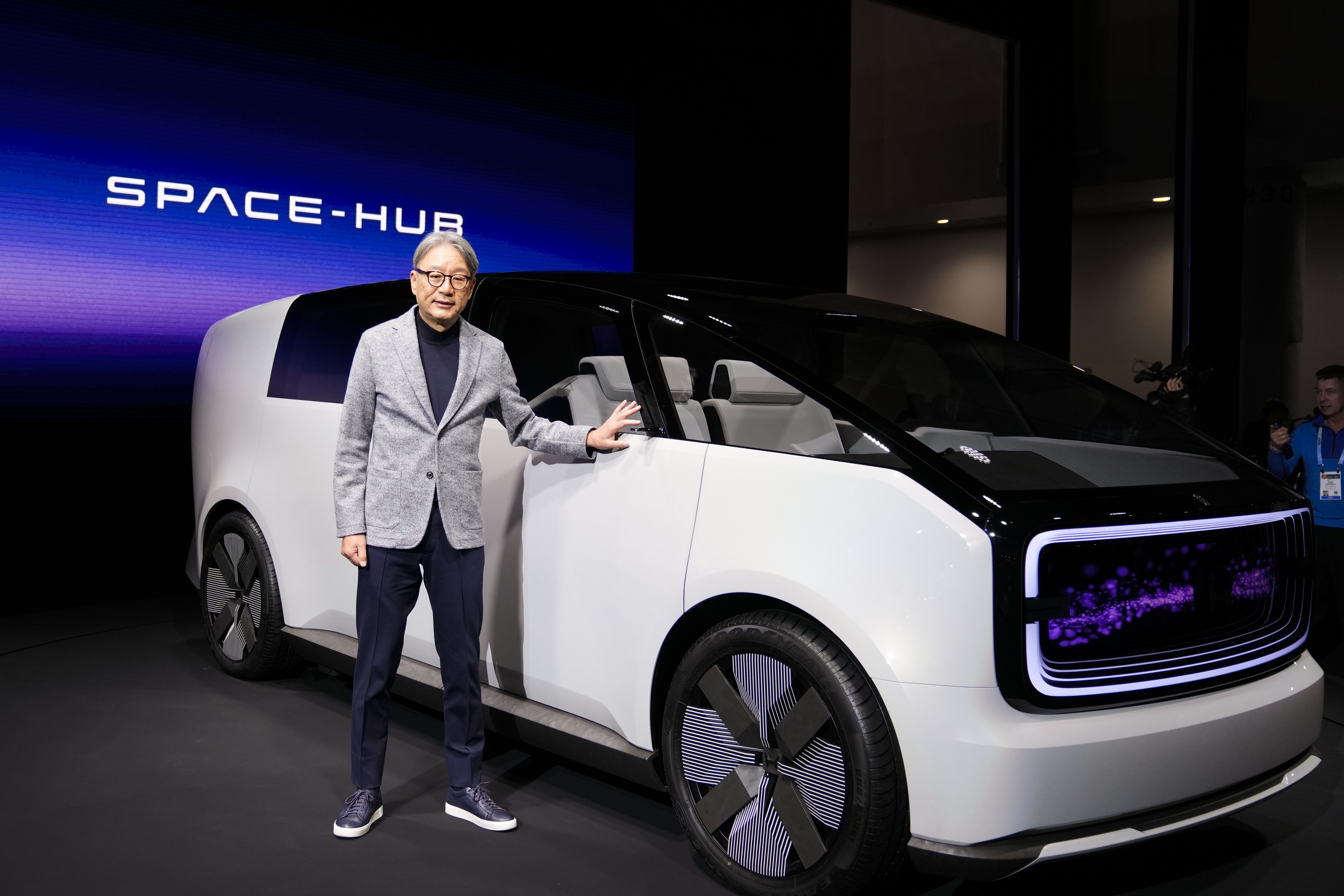 Toshihiro Mibe, director, president and representative executive officer of Honda Motor Co., poses next to the newly unveiled concept car, the Honda Zero Series &quot;Space-Hub&quot; electric vehicle during a Honda news conference during the CES tech show Tuesday, Jan. 9, 2024, in Las Vegas.<br />(Ryan Sun / AP Photo)