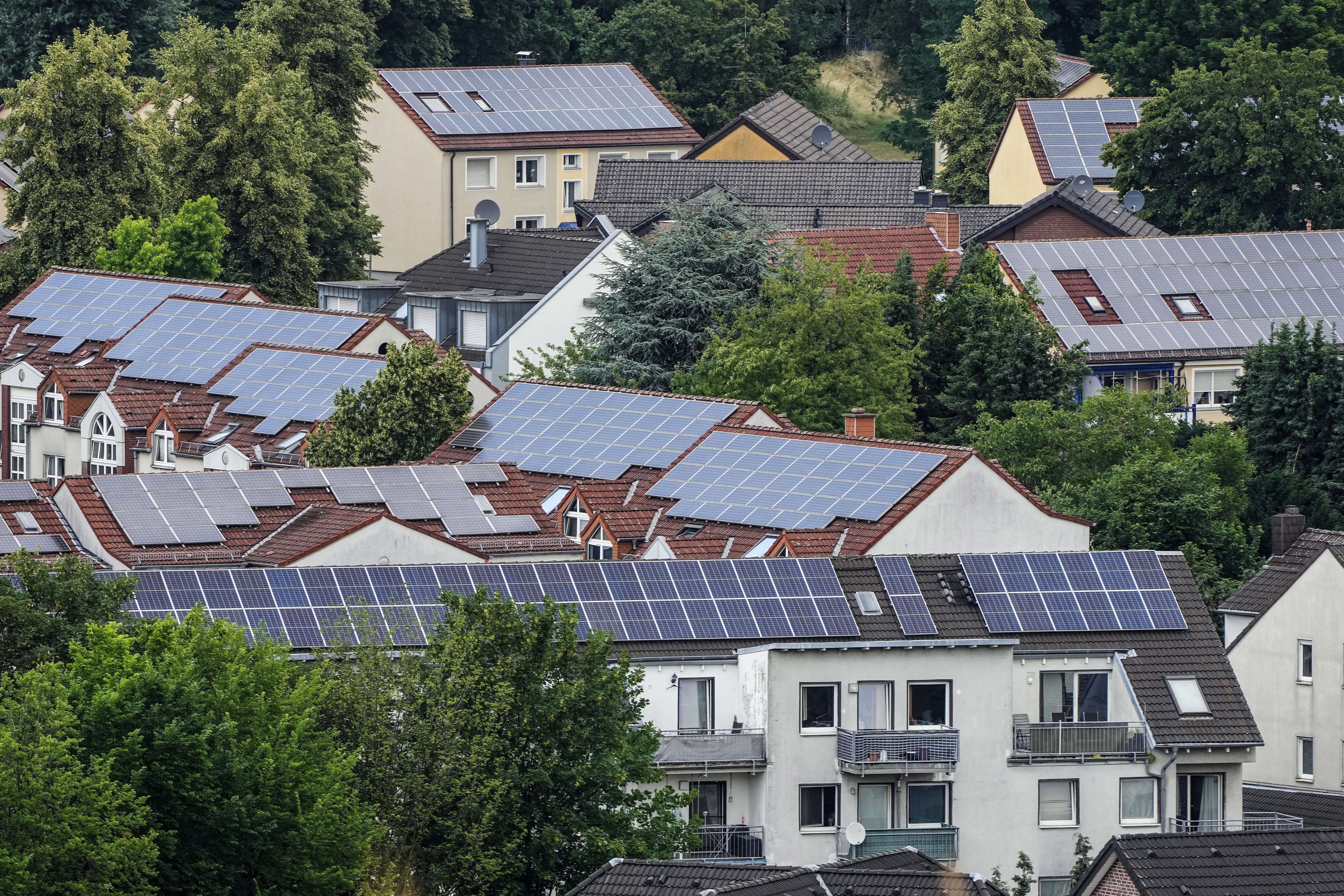 Solar panels are mounted on the roofs of apartment buildings in Bottrop, Germany, June 26, 2023. The world&#039;s renewable energy grew at its fastest rate in the past 25 years in 2023, the International Energy Agency reported Thursday, Jan. 11, 2024.<br />(Martin Meissner / AP Photo)
