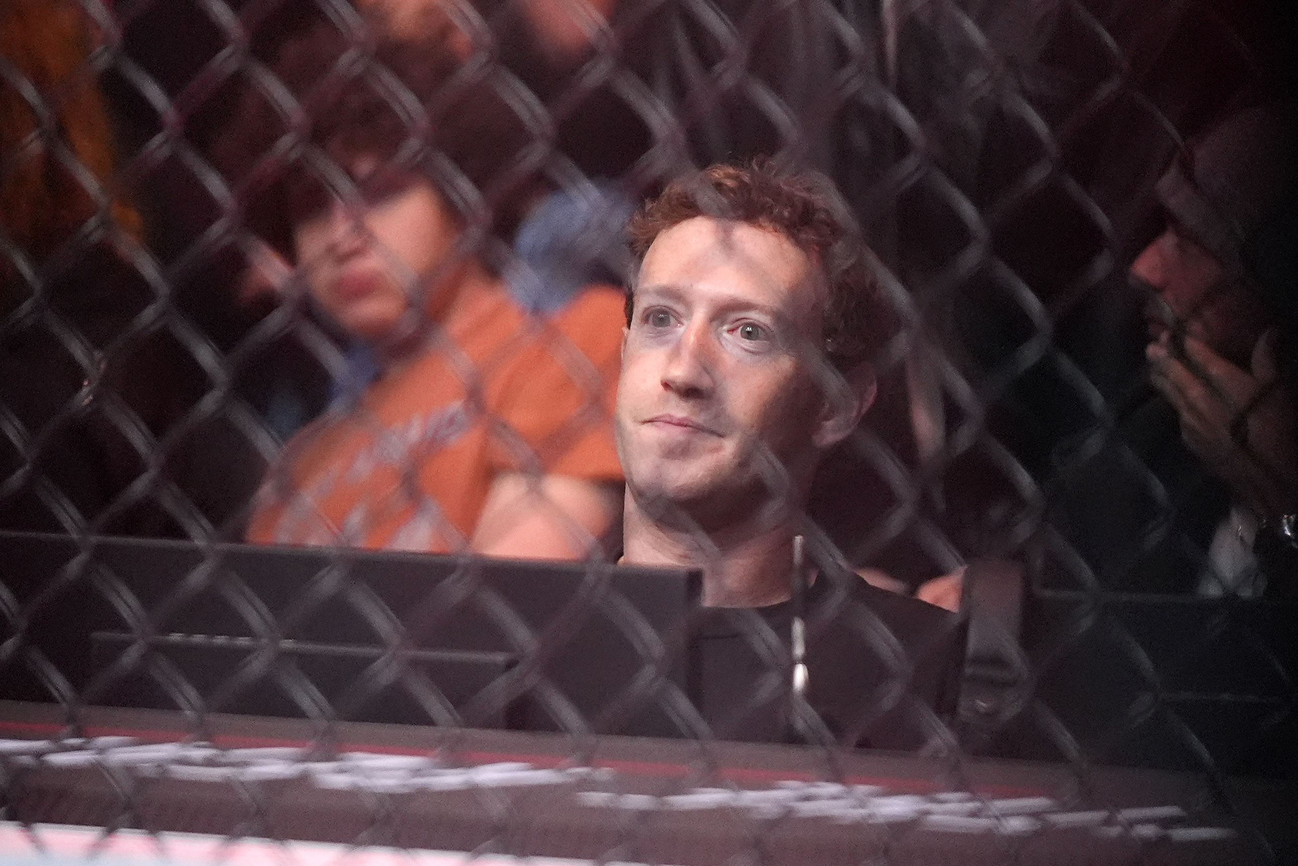Mark Zuckerberg watches a bout between Robert Whittaker and Paulo Costa during their middleweight bout at the UFC 298 mixed martial arts event Saturday, Feb. 17, 2024, in Anaheim, Calif.<br />(Mark J. Terrill / AP Photo)