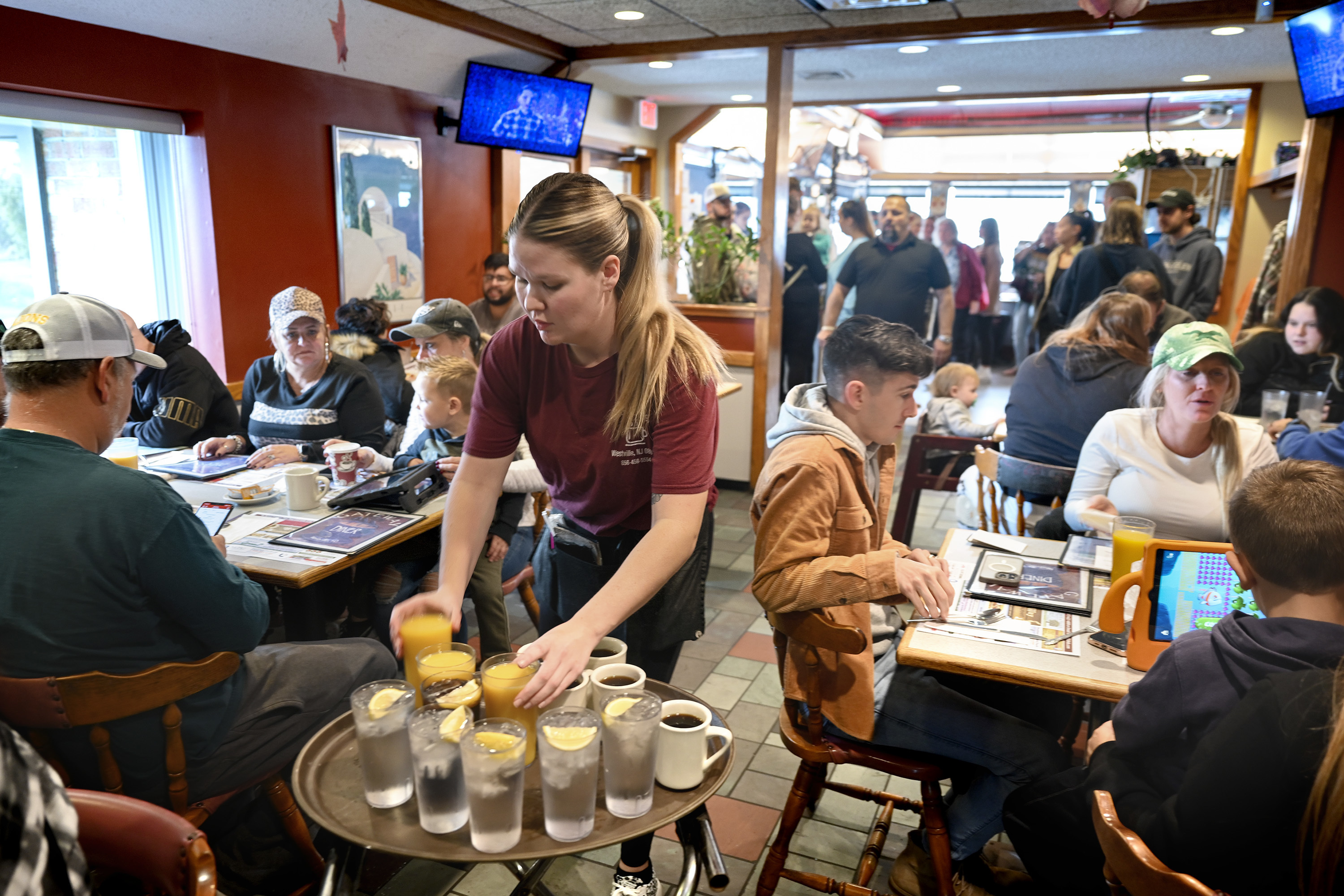 Waitress Rachel Gurcik serves customers at the Gateway Diner in Westville, Pa. on Oct. 22, 2023. On Friday, April 5, 2024, the U.S. government issues its March jobs report.<br />(Tom Gralish / The Philadelphia Inquirer via AP)
