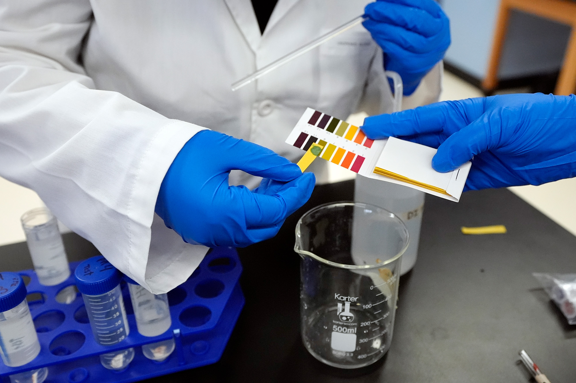 Sima Gutierrez checks the pH levels of a water sample at the Flint Community Water Lab, Wednesday, April 3, 2024, in Flint, Mich. The lab, with more than 60 high school and college interns, has provided free water testing for thousands of residents since 2020.<br />(Carlos Osorio / AP Photo)