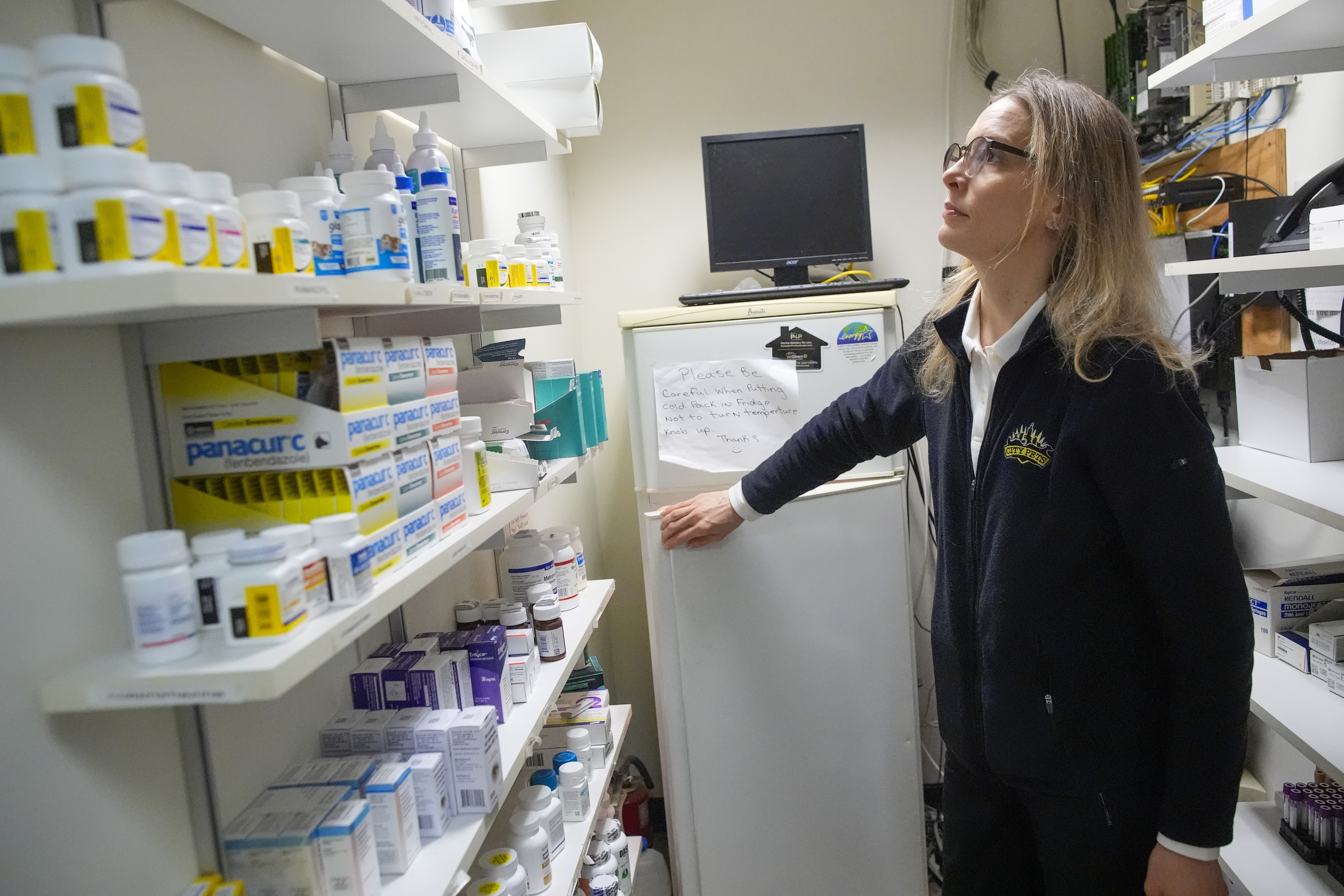 Licensed veterinary technician Jeanine Lunz looks over medical supplies at the City Pets office before leaving for a house call with Dr. Amy Attas, Tuesday, April 23, 2024, in New York.<br />(Mary Altaffer / AP Photo)