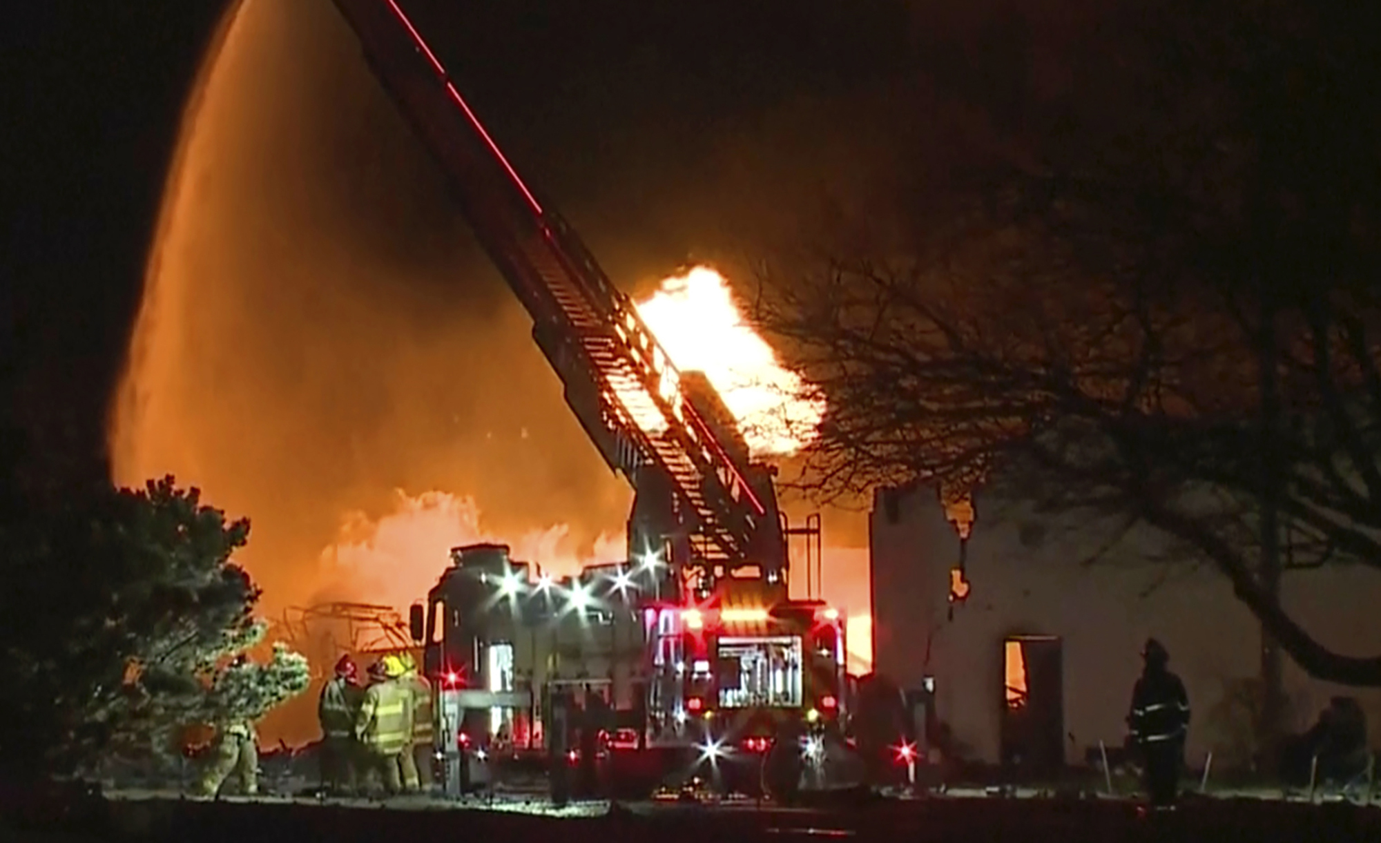In this frame grab taken from video provided by WXYZ, firefighters battle an industrial fire in the Detroit suburb of Clinton Township, March 4, 2024.<br />(WXYZ via AP)