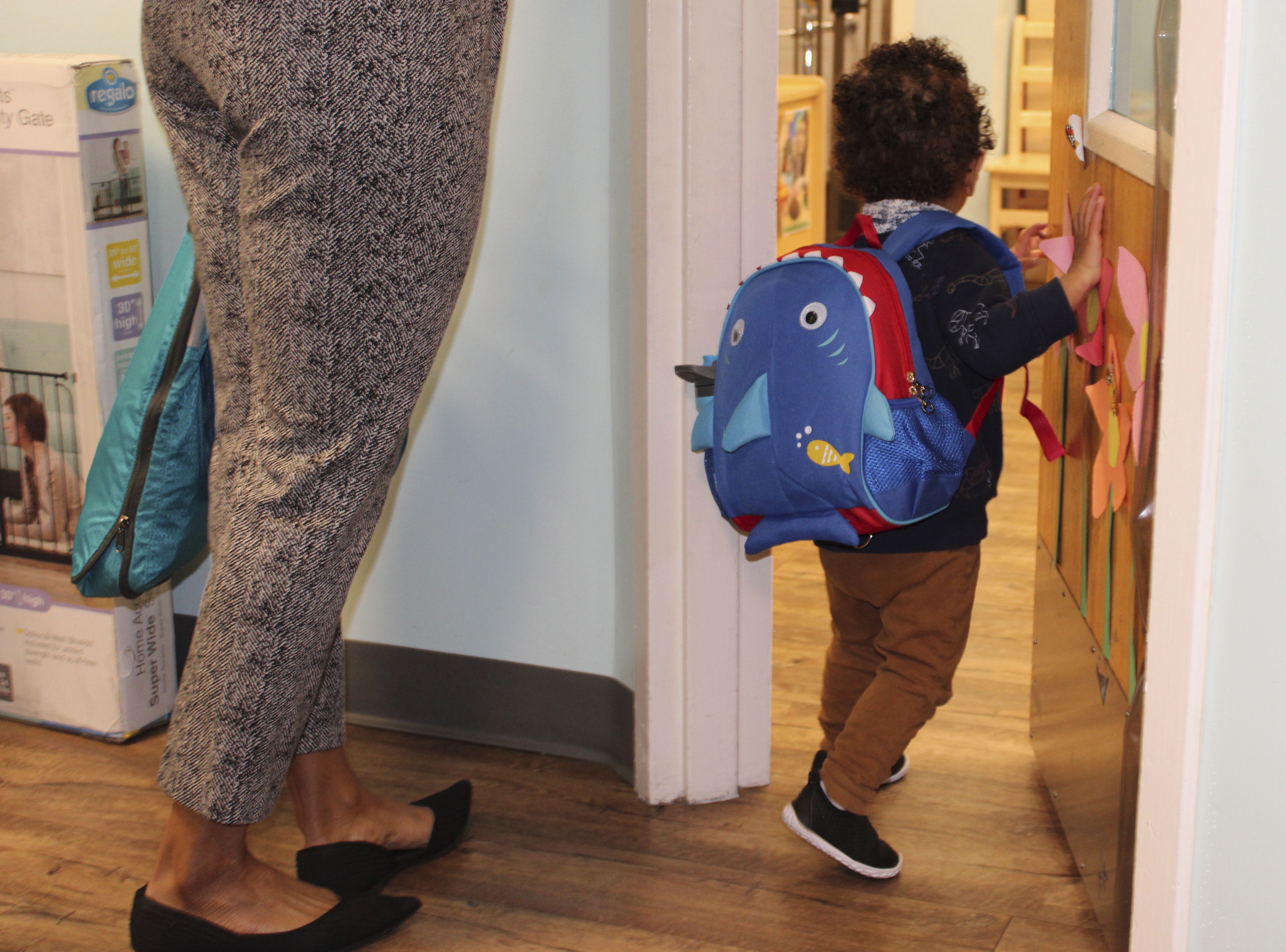 A young boy enters the toddler room with his mother at the KinderCare Child Development Center at The Venetian Resort Las Vegas April 18, 2024.<br />(Jackie Valley / The Christian Science Monitor via AP)