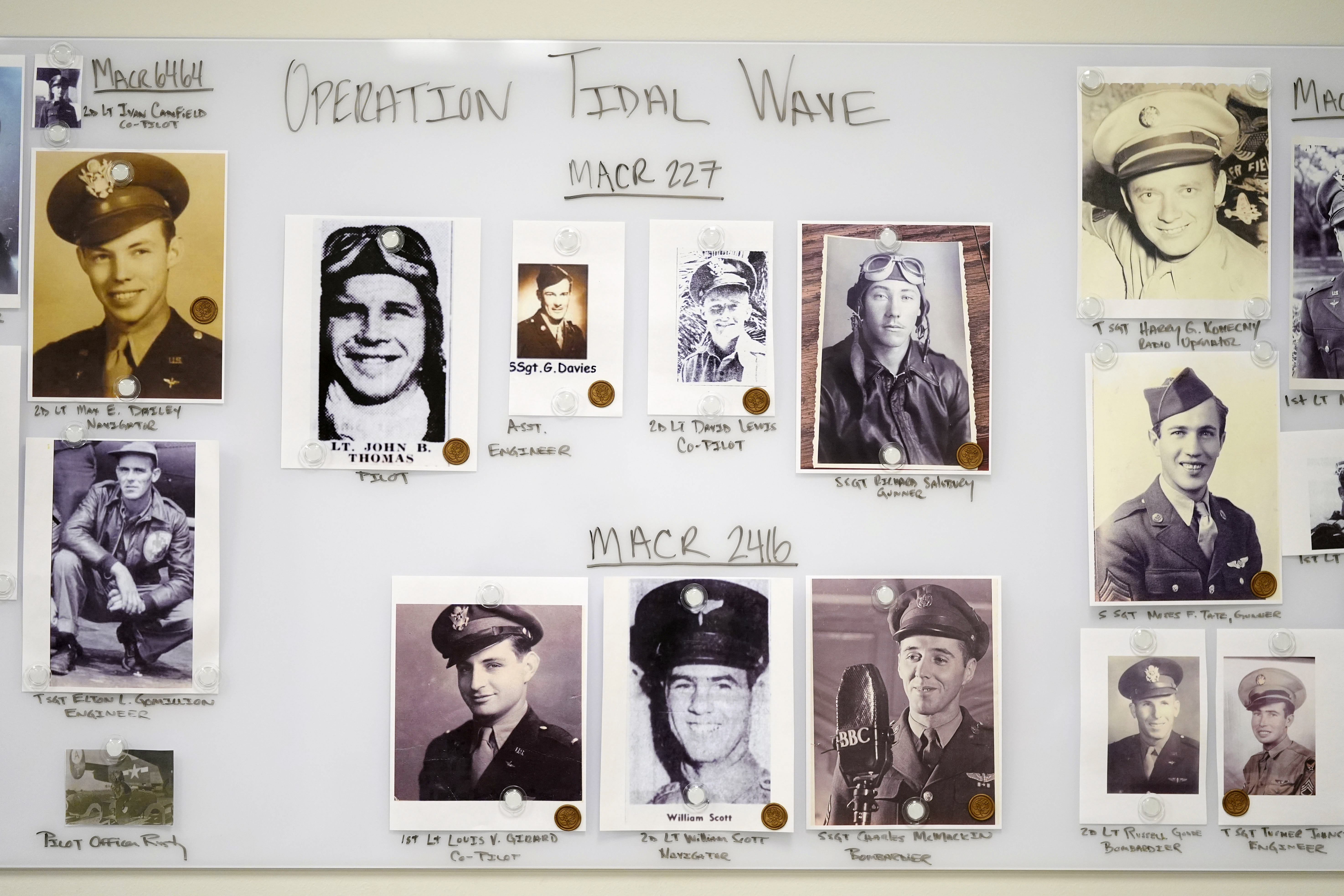 Photos of service members are seen on a wall in a Defense POW/MIA Accounting Agency lab at Offutt Air Force Base, Monday, May 20, 2024, in Bellevue, Neb.<br />(Charlie Neibergall / AP Photo)