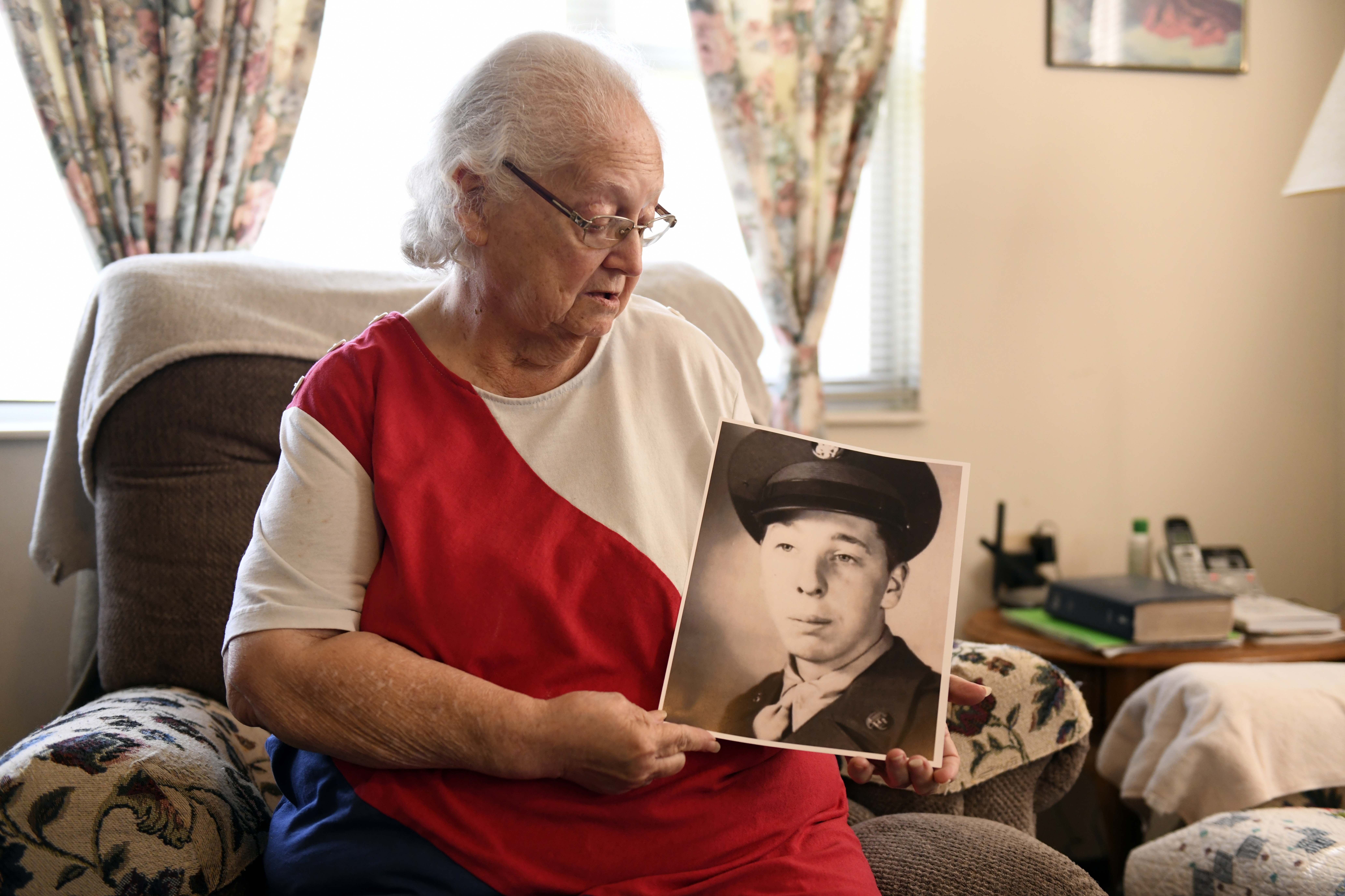 Donna Kennedy holds a photo of her cousin, Cpl. Charles Ray Patten who was buried with full military honors, Monday, May 20, 2024 in Lawson, Mo. He was identified by the Defense POW/MIA Accounting Agency. Patten died 74 years earlier in the Korean War, but spent decades buried as an unknown in the National Memorial Cemetery of the Pacific in Hawaii.<br />(Nick Ingram / AP Photo)