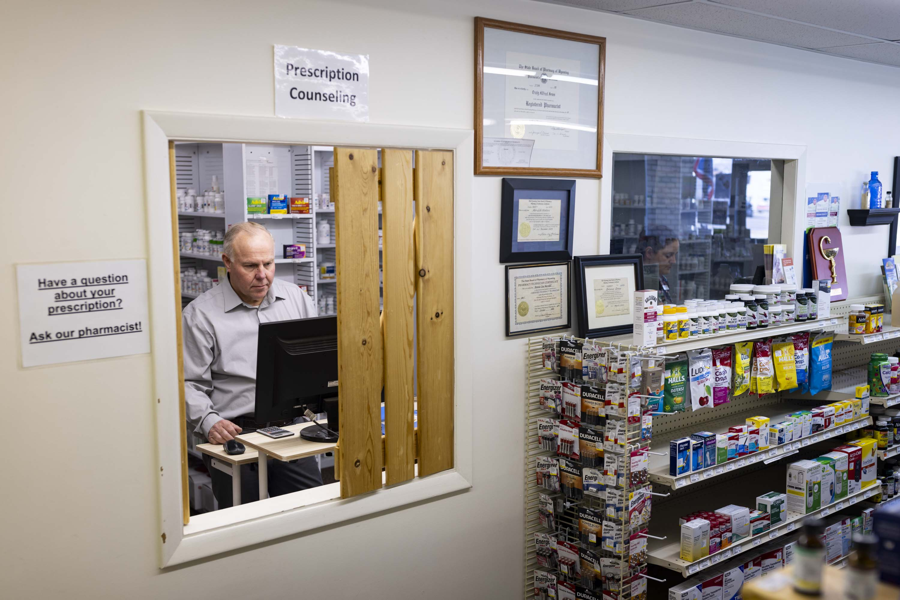 Craig Jones works at Basin Pharmacy in Basin, Wyo., on Wednesday, Feb. 21, 2024. Some 25% of the prescriptions he fills are reimbursed for less than what he bought the medications for. Jones said he lost $30,000 between the beginning of the year and mid-May.<br />(Mike Clark / AP Photo)