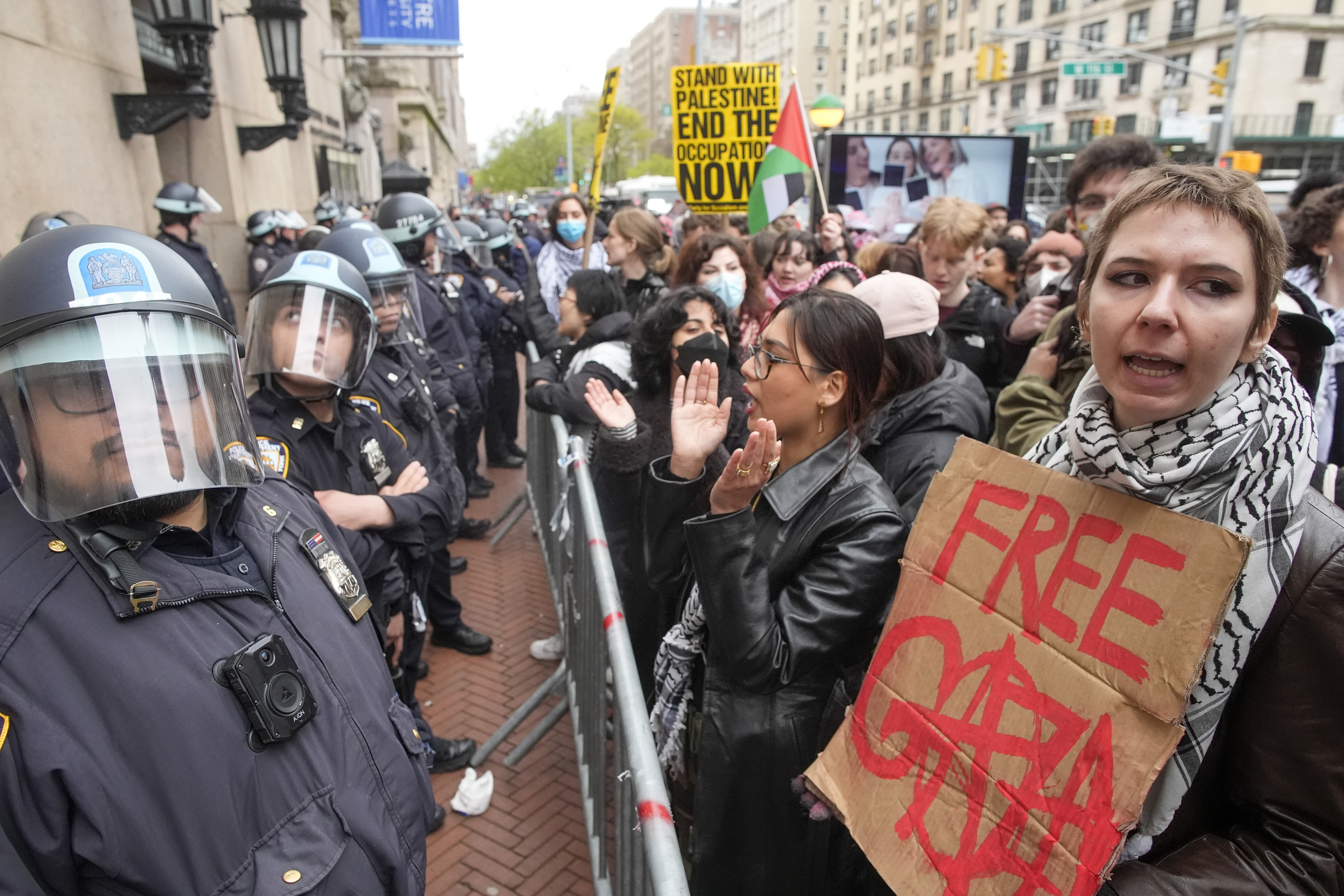 Police stand guard as demonstrators chant slogans outside the Columbia University campus, on April 18, 2024, in New York. The student-run legal journal, Columbia Law Review, was taken offline Monday, June 3, 2024, after its board of directors objected to the publication of an article that accused Israel of genocide.<br />(Mary Altaffer / AP Photo)