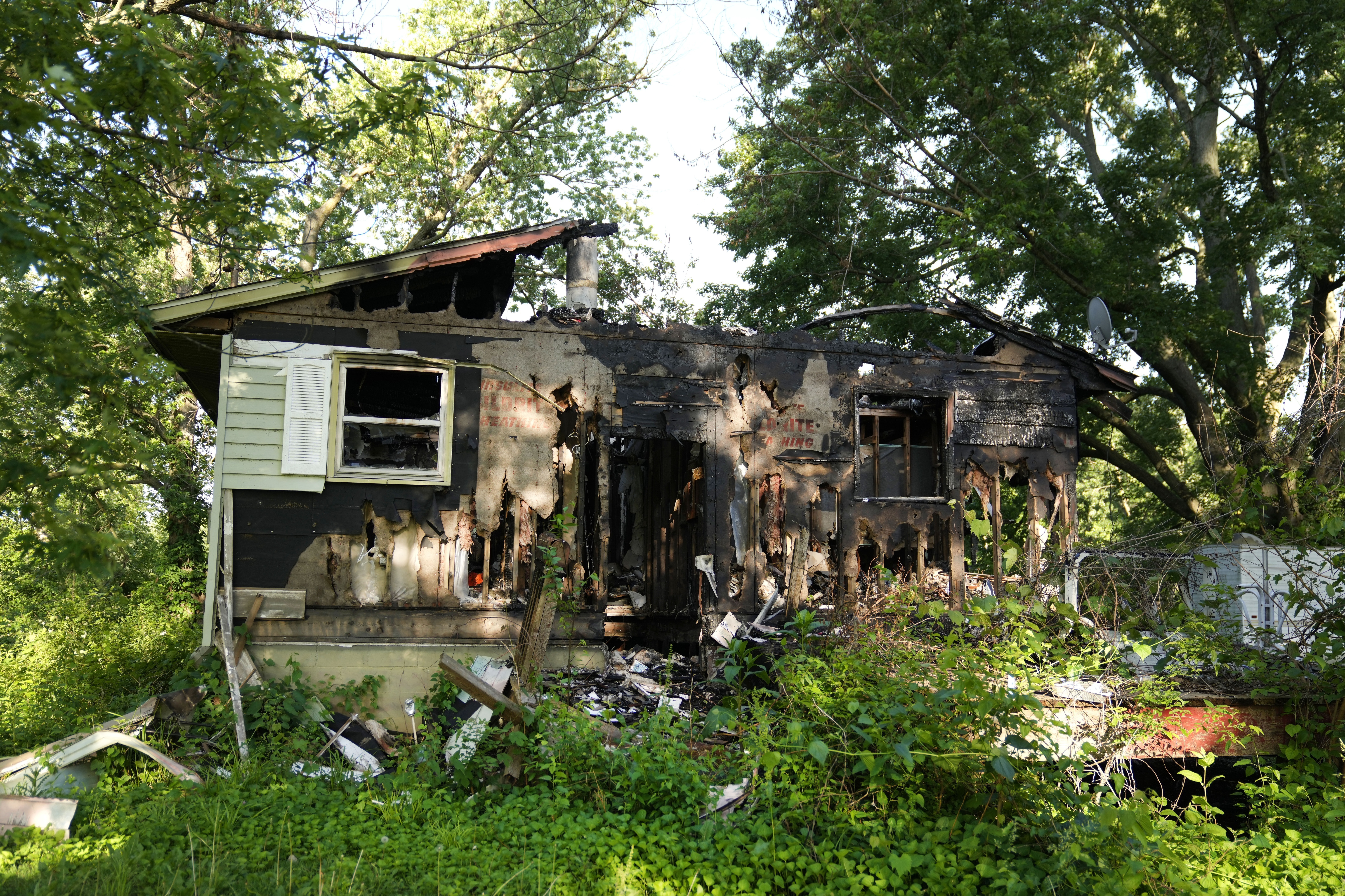 A flood-damaged and recently burned home is visible Wednesday, May 22, 2024, in West Alton, Mo. Data from First Street shows that while West Alton is an extreme example of flooding&#039;s effect, it&#039;s emblematic of challenges faced by smaller communities in the Midwest and South.<br />(Jeff Roberson / AP Photo)