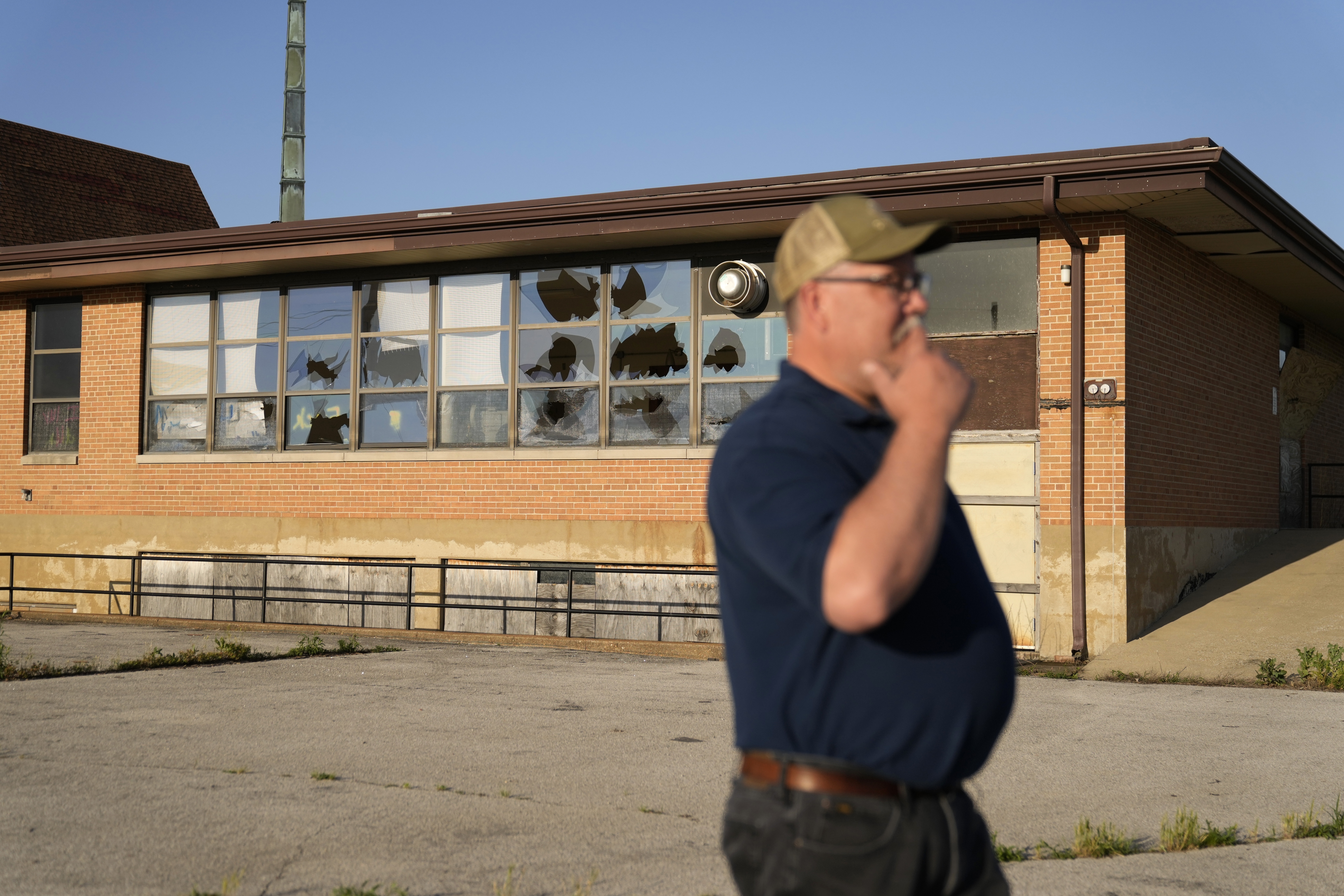 West Alton Mayor Willie Richter speaks outside a vacant and vandalized church Wednesday, May 22, 2024, in West Alton, Mo. Richter recalls the West Alton of decades ago: three churches, an ice cream shop, four taverns where people hung out. &quot;Now we don&#039;t have any churches. We have one tavern that&#039;s open and it just got reopened not too long ago,&quot; he said.<br /> (Jeff Roberson / AP Photo)