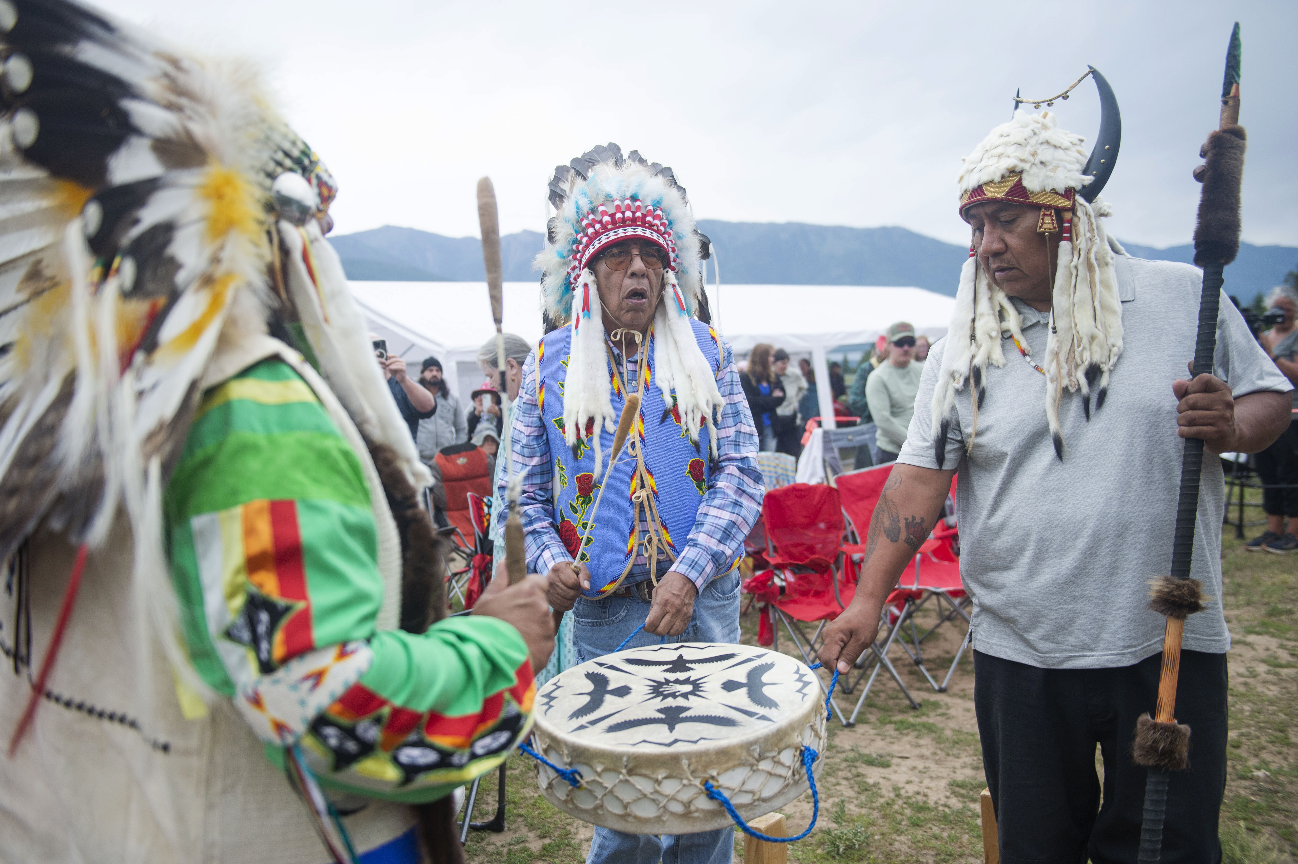 Drummers sing a song at the end of a naming ceremony for a white buffalo calf at the headquarters of the Buffalo Field Campaign in West Yellowstone, Mont., Wednesday, June 26, 2024. The reported birth of the calf in Yellowstone National Park fulfills a Lakota prophecy that portends better times.<br /> (Sam Wilson / AP Photo)