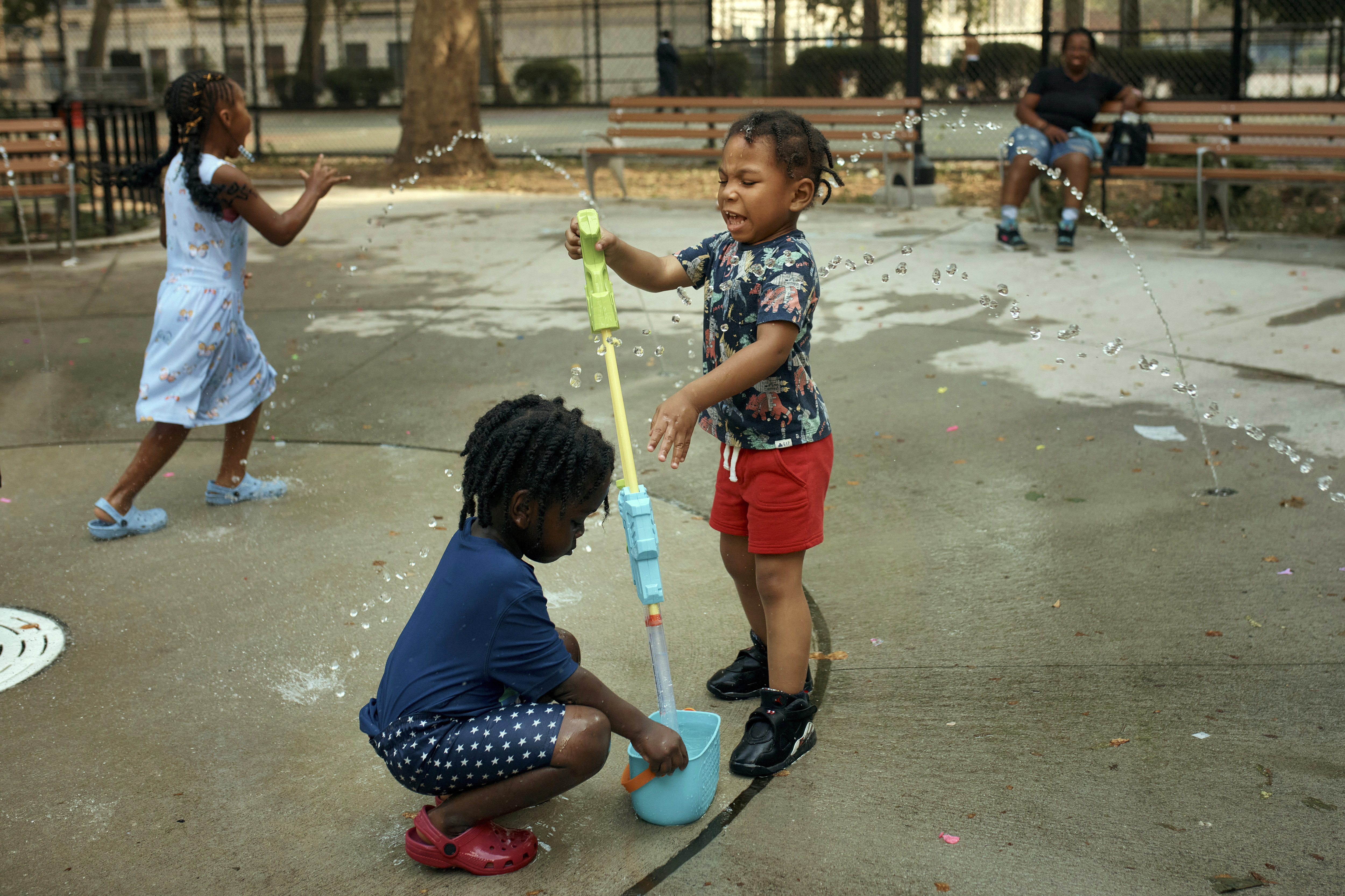 Children play in a water park on a hot day, Friday, June 21, 2024, in the Bronx Borough of New York. Tens of millions of Americans are facing major heat waves, with temperatures consistently exceeding 90 degrees (32 degrees Celsius).<br />(Andres Kudacki / AP Photo)