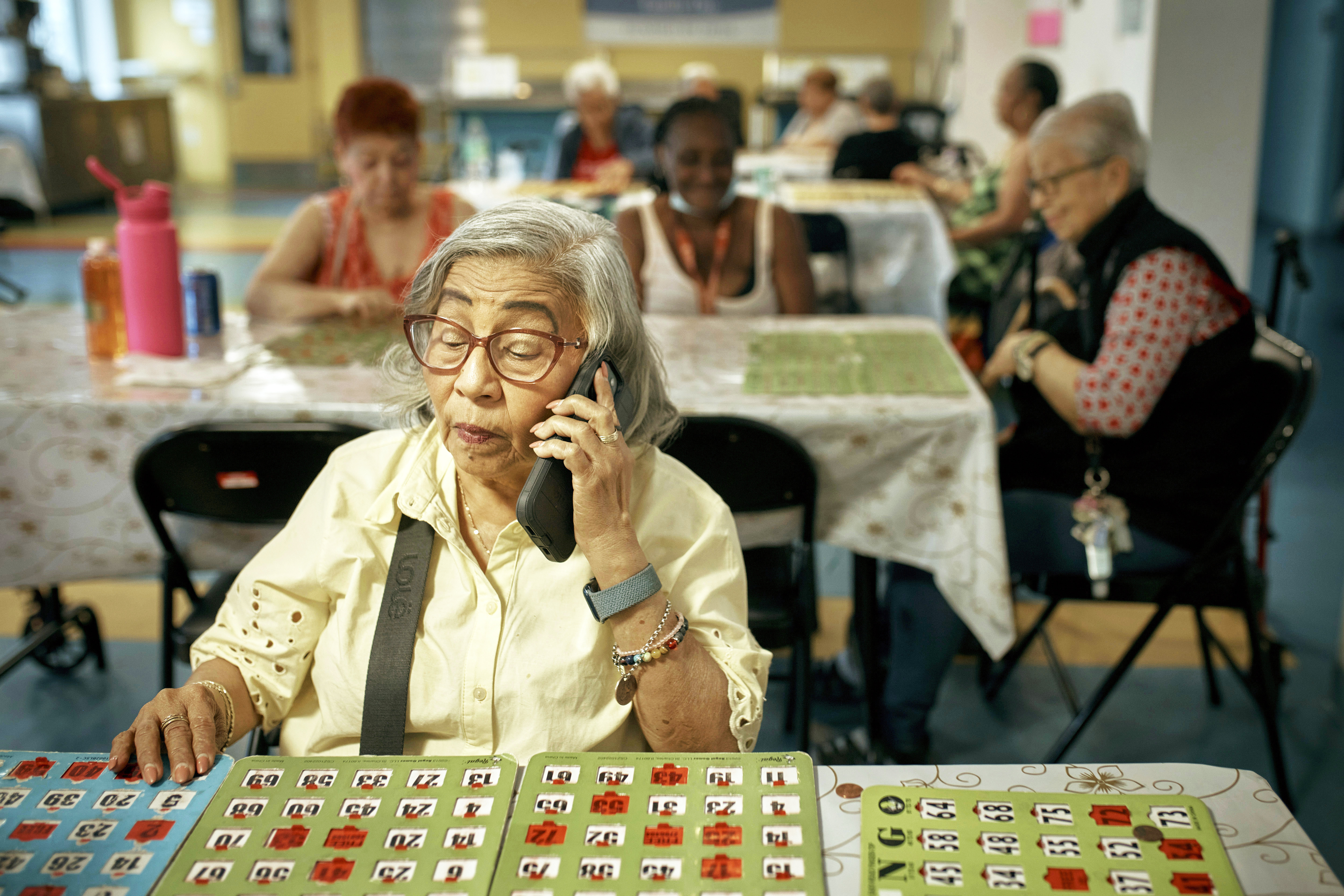 Elderly women play bingo at a cooling center during a hot day, Friday, June 21, 2024, in the Bronx Borough of New York. The heat isn’t just uncomfortable. It’s the top cause of weather-related fatalities nationwide, quietly killing an average of 350 New Yorkers each year, according to a city mortality report.<br />(Andres Kudacki / AP Photo)