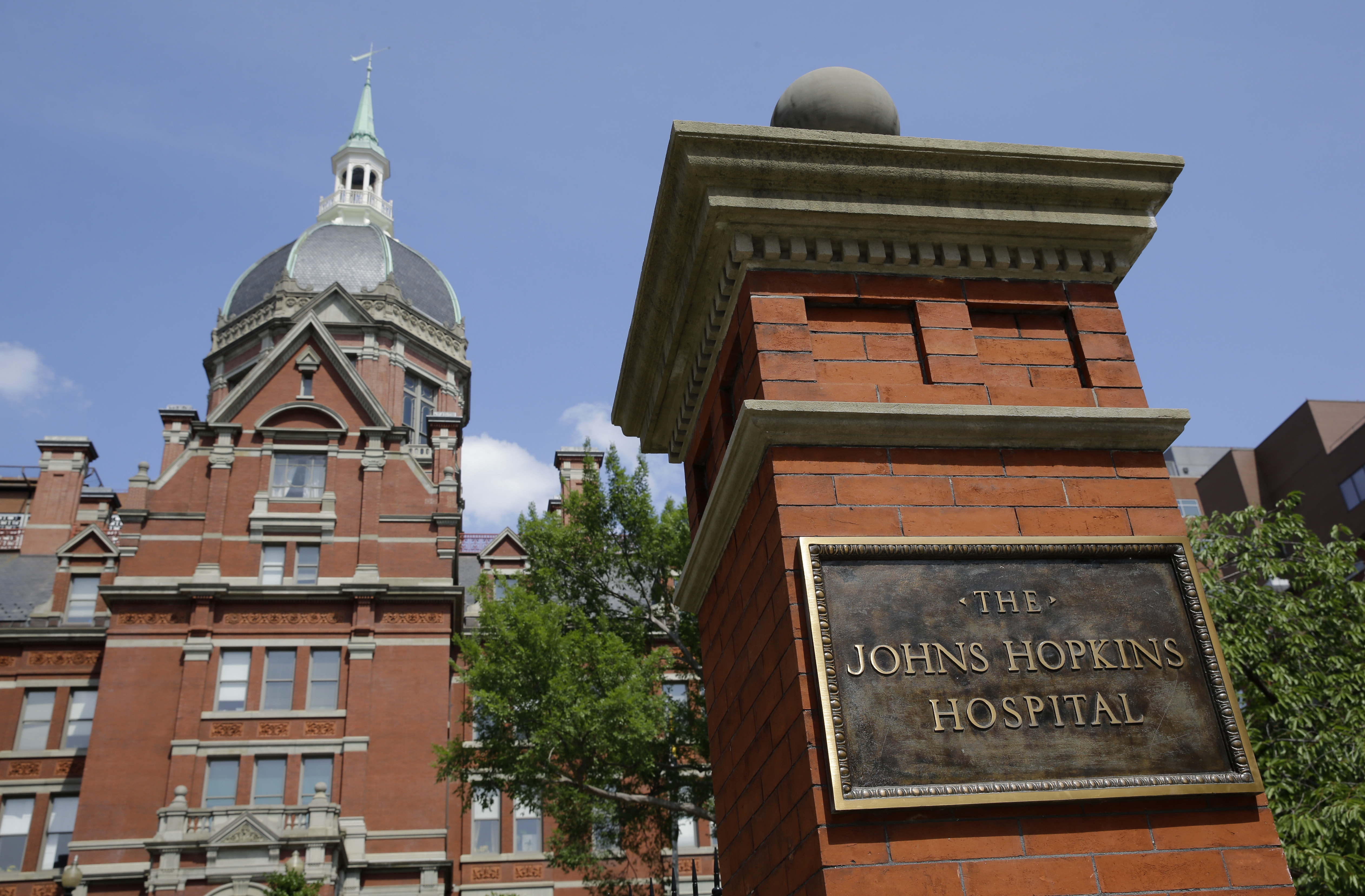 A sign stands in front of part of the Johns Hopkins Hospital complex, July 8, 2014, in Baltimore. Most medical students at Johns Hopkins University will no longer pay tuition thanks to a $1 billion gift from Bloomberg Philanthropies. Starting in the fall, the gift announced Monday, July 8, 2024 will cover full tuition for medical students from families earning less than $300,000.<br /> (Patrick Semansky / AP Photo, file)
