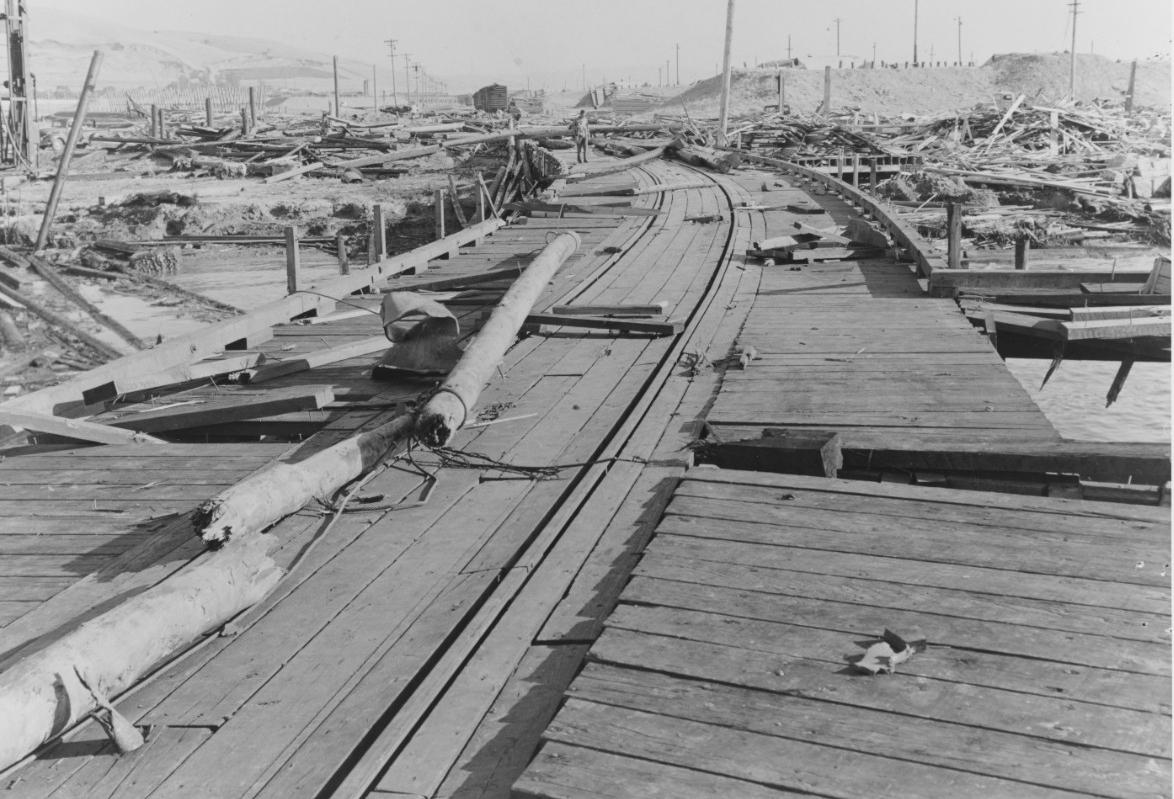 This image shows the wreckage of the Building A-7 Joiner Shop (right), from the July 17, 1944 explosion at Port Chicago naval weapons station near San Francisco.<br />(Naval History and Heritage Command / Mare Island Navy Yard via AP)