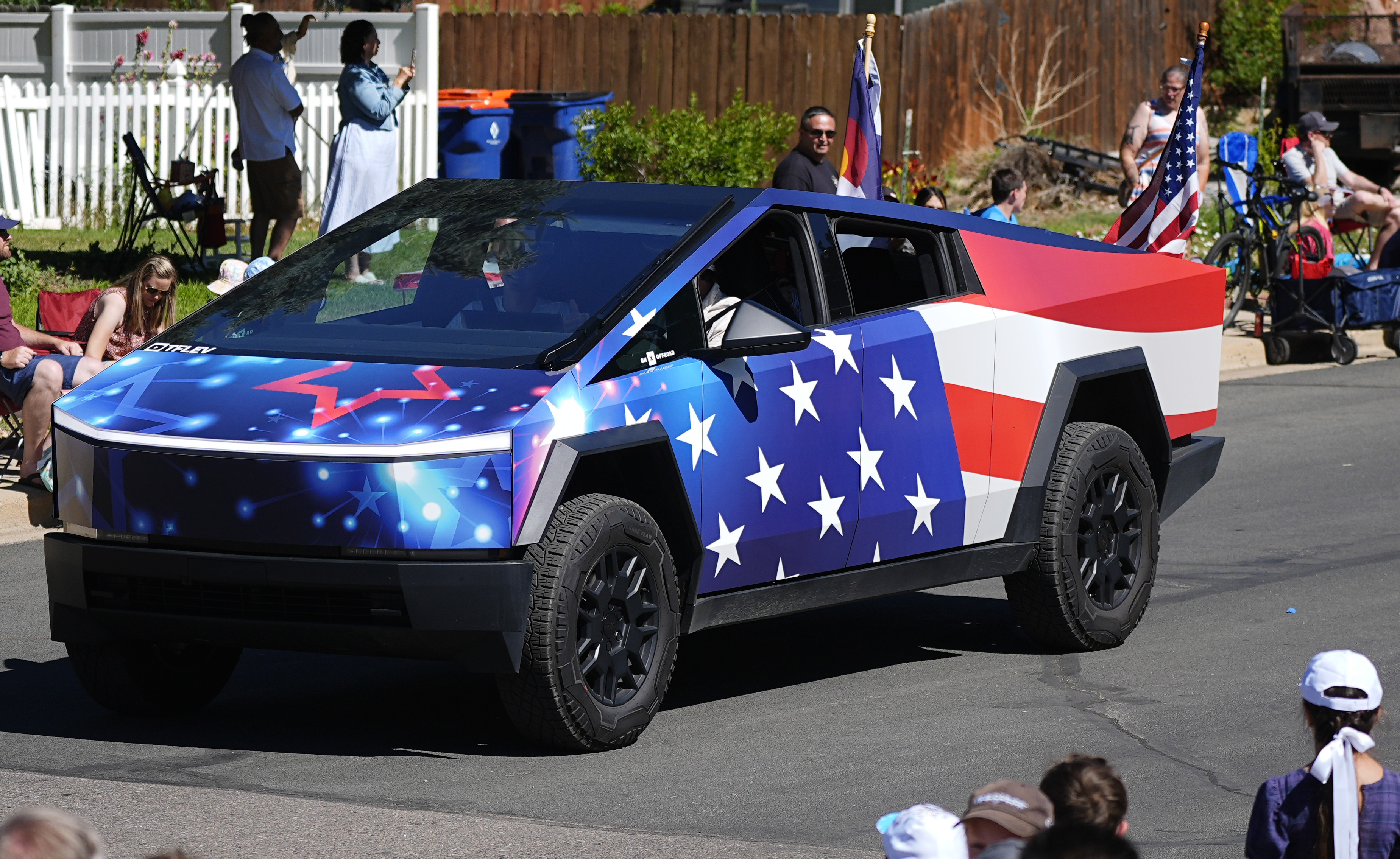 A Tesla Cybertruck wrapped in patriotic motif rolls along in the Colorado 4th at Firestone parade to mark the Independence Day holiday July 4, 2024, in Firestone, Colo.<br />(David Zalubowski / AP Photo)