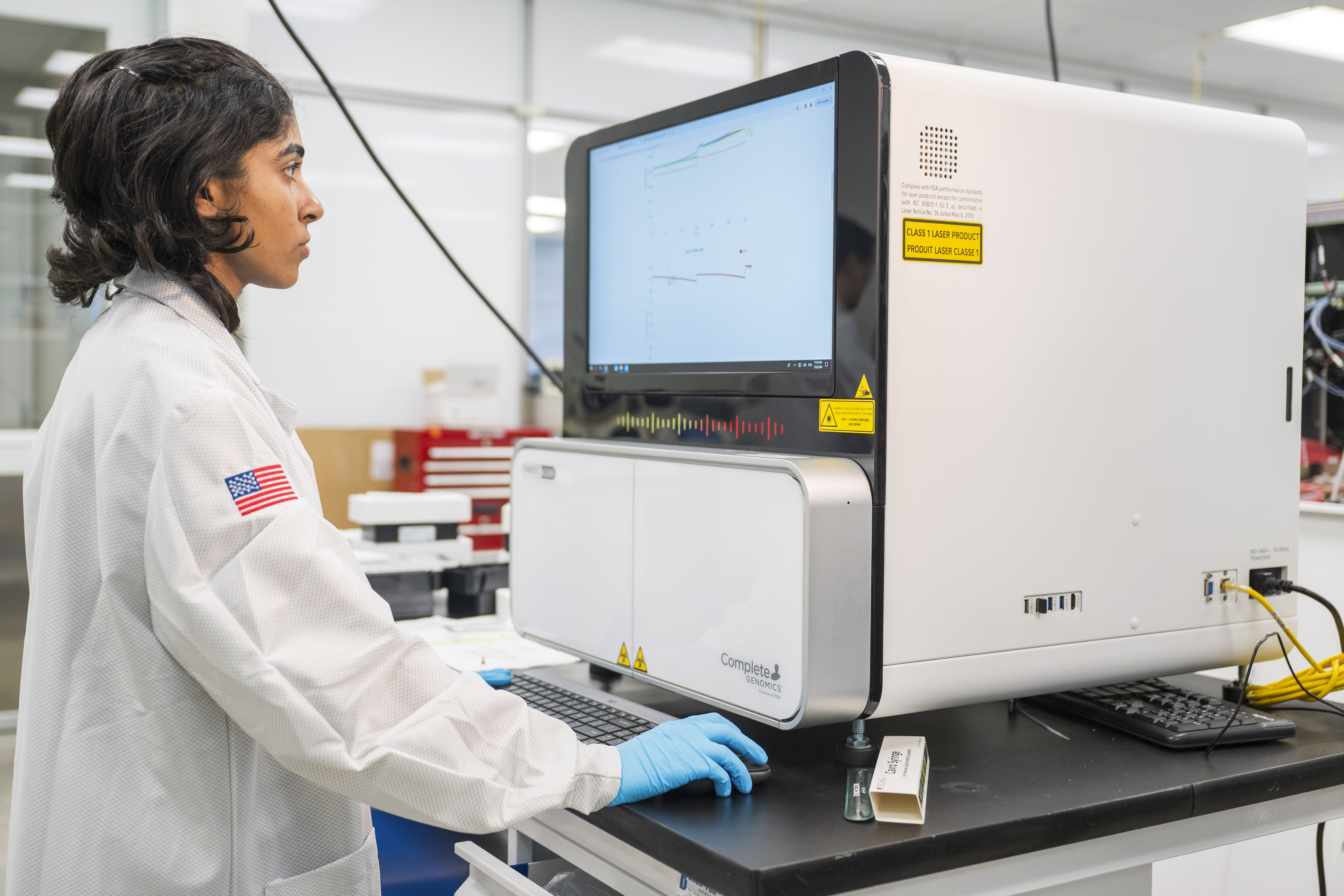 A lab technician works on a sequencer inside the quality control department at Complete Genomics in San Jose, Calif., Monday, July 22, 2024.<br />(Nic Coury / AP Photo)