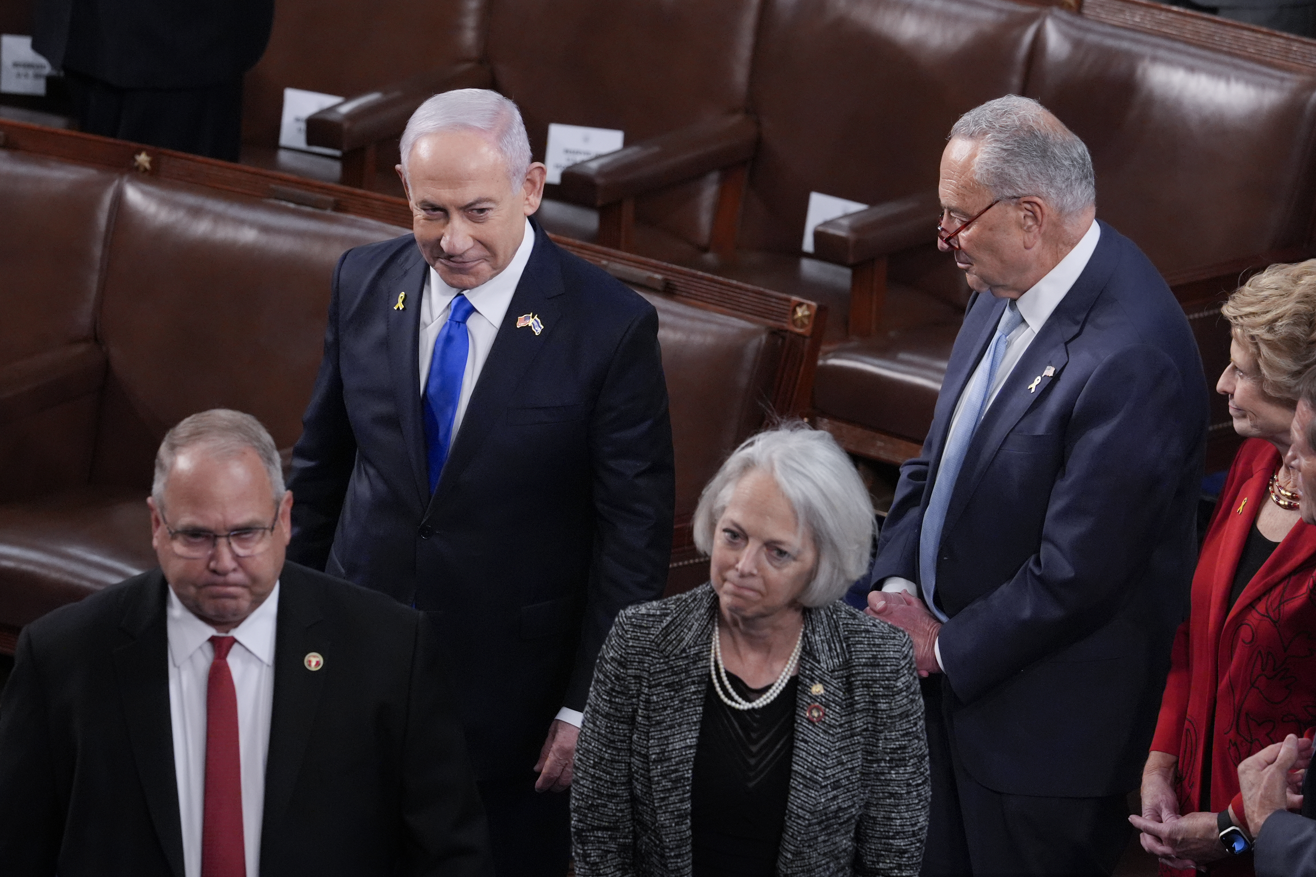 Israeli Prime Minister Benjamin Netanyahu (top left) walks past Senate Majority Leader Chuck Schumer, D-N.Y. (top right) as he arrives to speak to a joint meeting of Congress to seek support for Israel&#039;s fight against Hamas and other adversaries, at the Capitol in Washington, Wednesday, July 24, 2024.<br />(J. Scott Applewhite / AP Photo)
