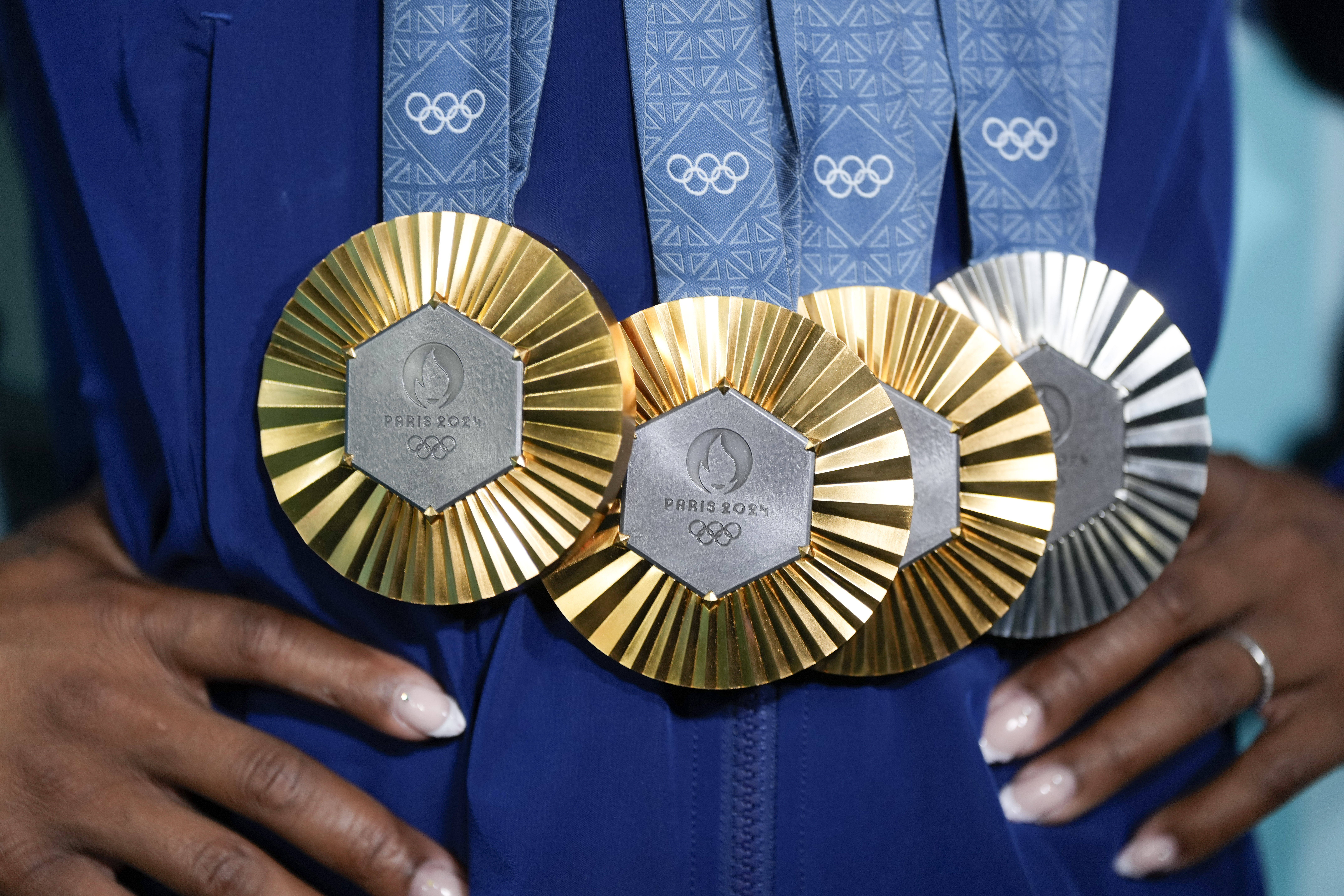 Simone Biles, of the United States, holds up her medals after the women&#039;s artistic gymnastics individual apparatus finals Bercy Arena at the 2024 Summer Olympics, Monday, Aug. 5, 2024, in Paris, France.<br />(Charlie Riedel / AP Photo)