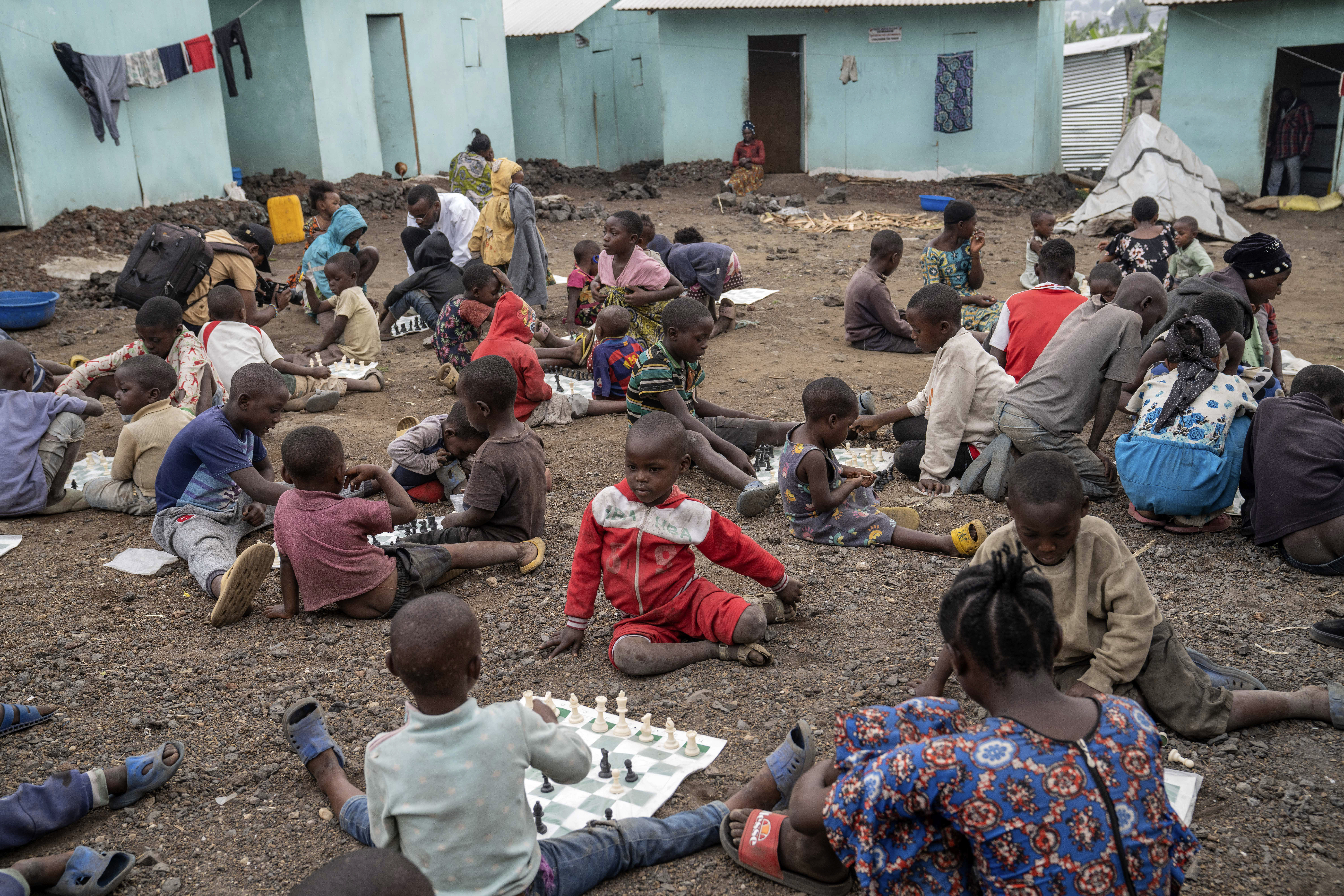 Children play chess at &#039;The Soga Chess Club&#039; of the internally displaced persons camp in Kanyaruchinya, Democratic Republic of Congo, Monday, July 29, 2024.<br />(Moses Sawasawa / AP Photo)