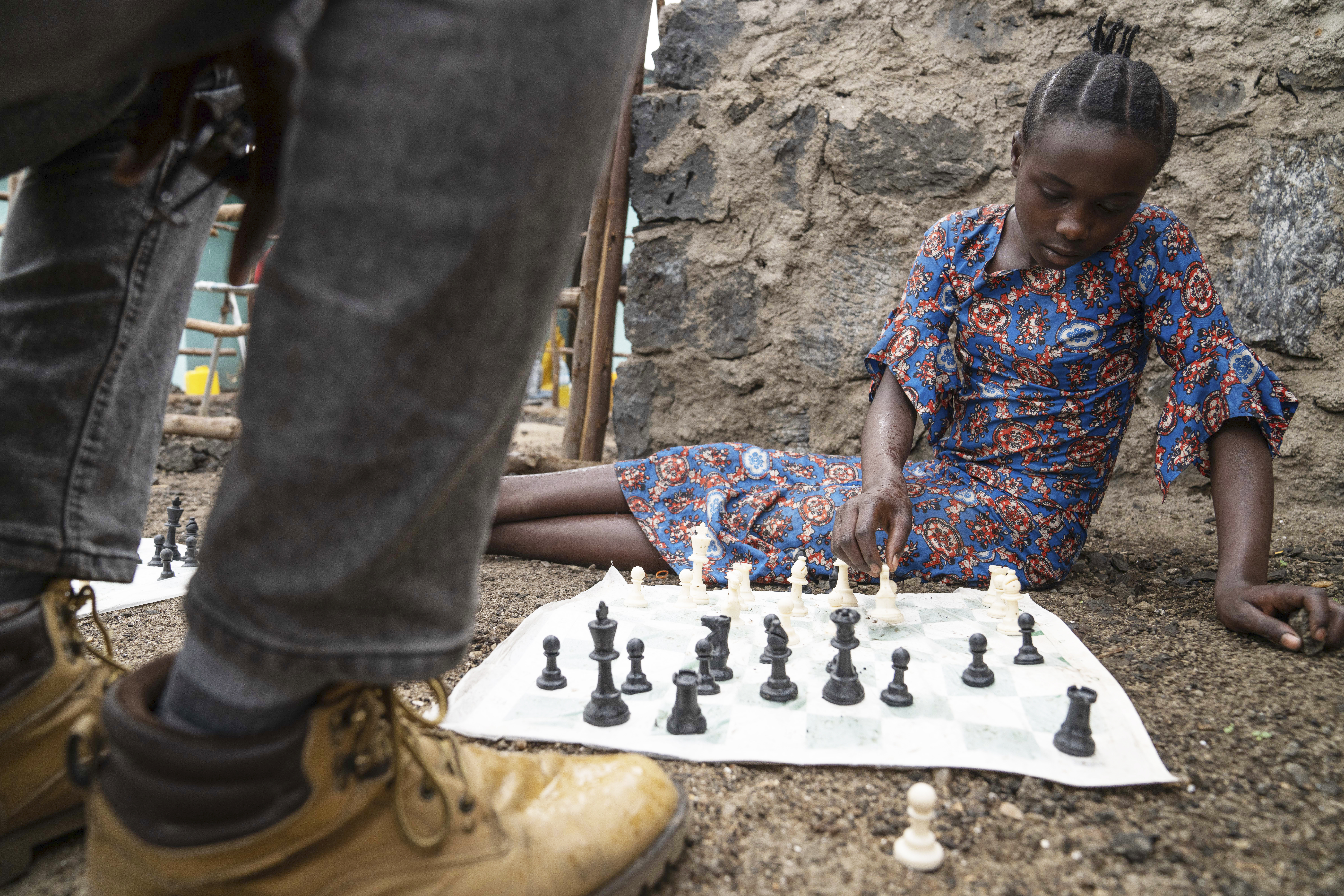 13 year-old Arusi Wegeneza plays a chess game at &#039;The Soga Chess Club&#039; of the internally displaced persons camp in Kanyaruchinya, Democratic Republic of Congo, Monday, July 29, 2024.<br />(Moses Sawasawa / AP Photo)