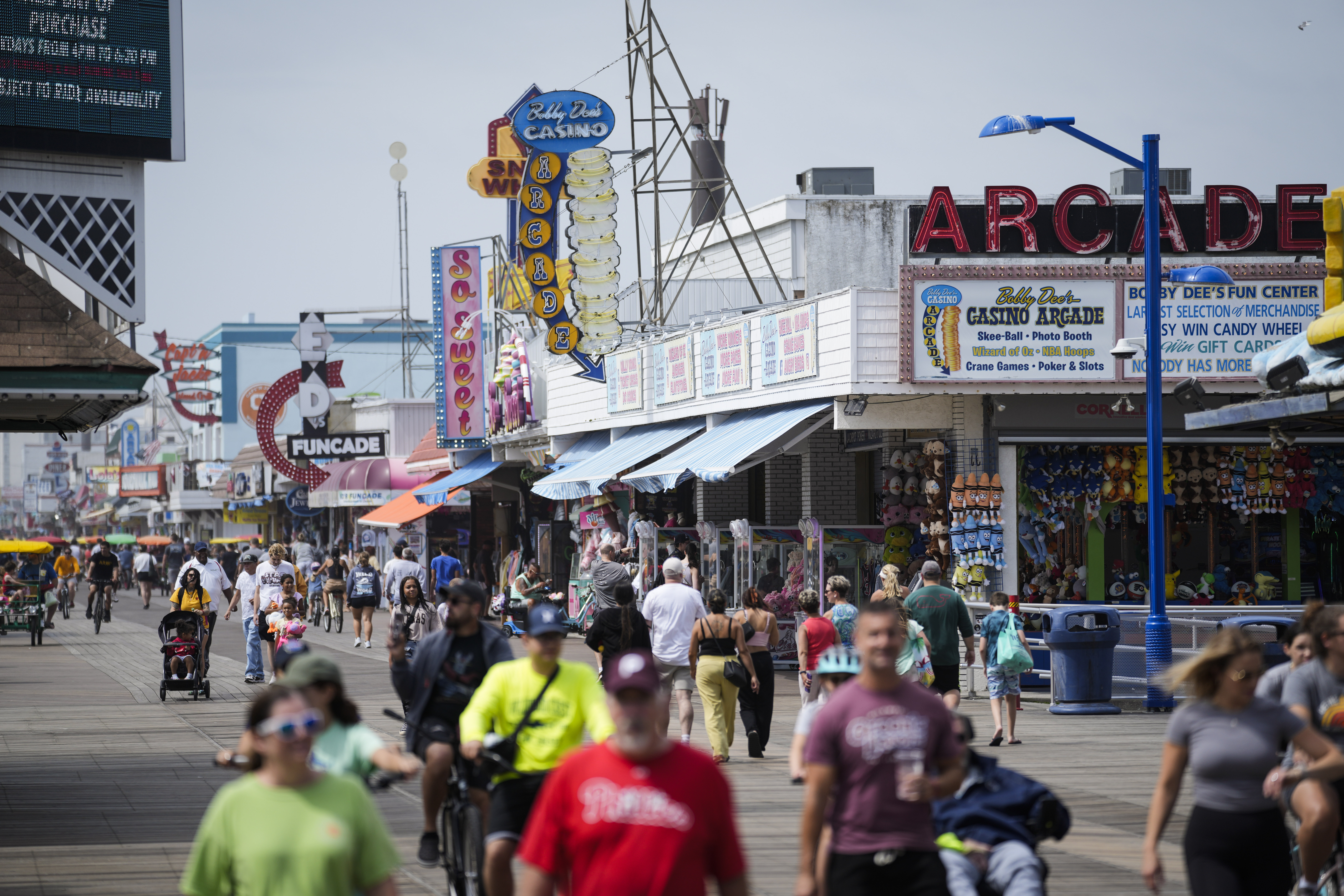 Visitors stroll past arcades on the boardwalk in Wildwood, N.J., Friday, Aug. 9, 2024.<br />(Matt Rourke / AP Photo)