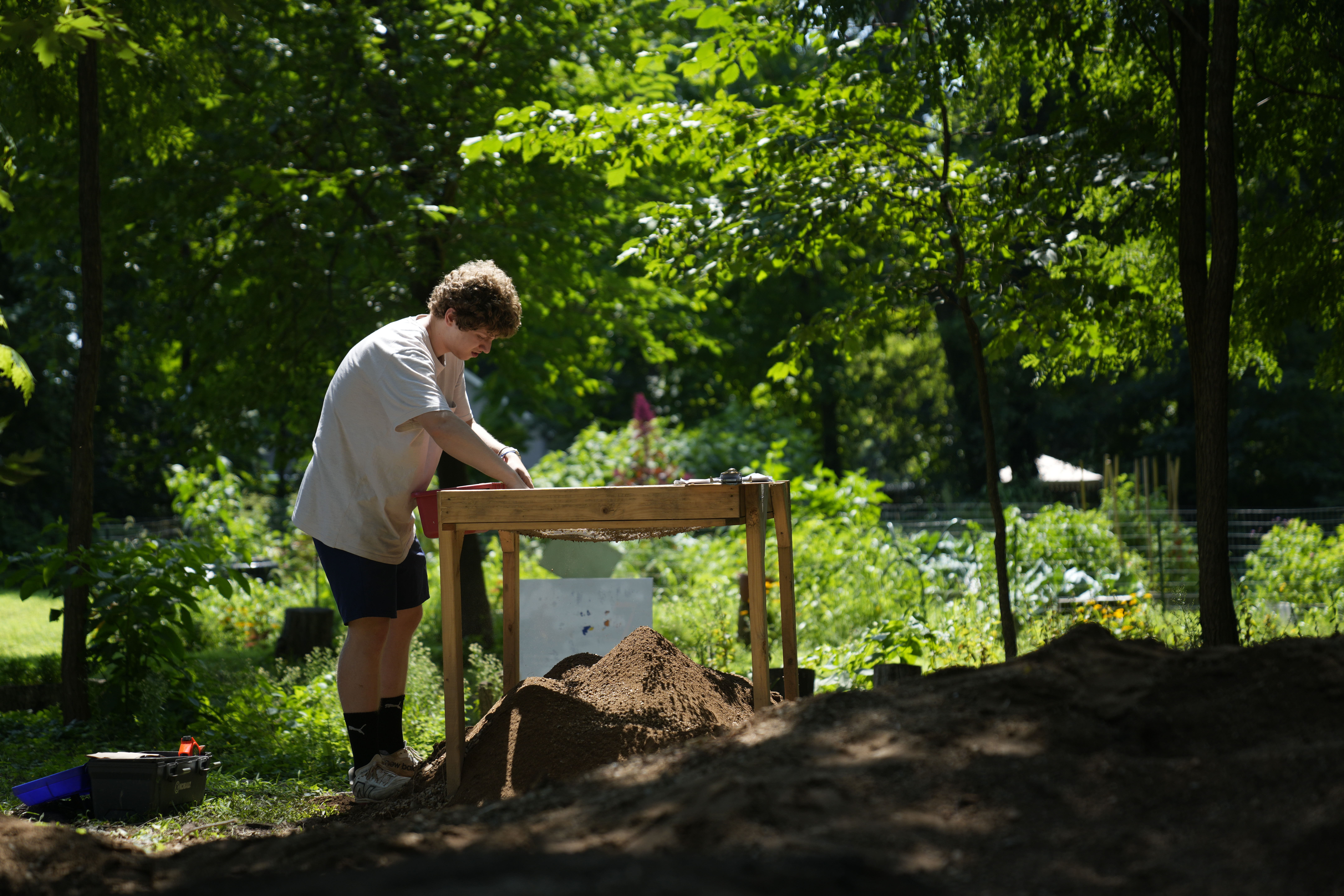 Alec Murillo sifts through dirt for artifacts while working at the site of an African burial ground in Kingston, N.Y., Monday, Aug. 5, 2024.<br />(Seth Wenig / AP Photo)