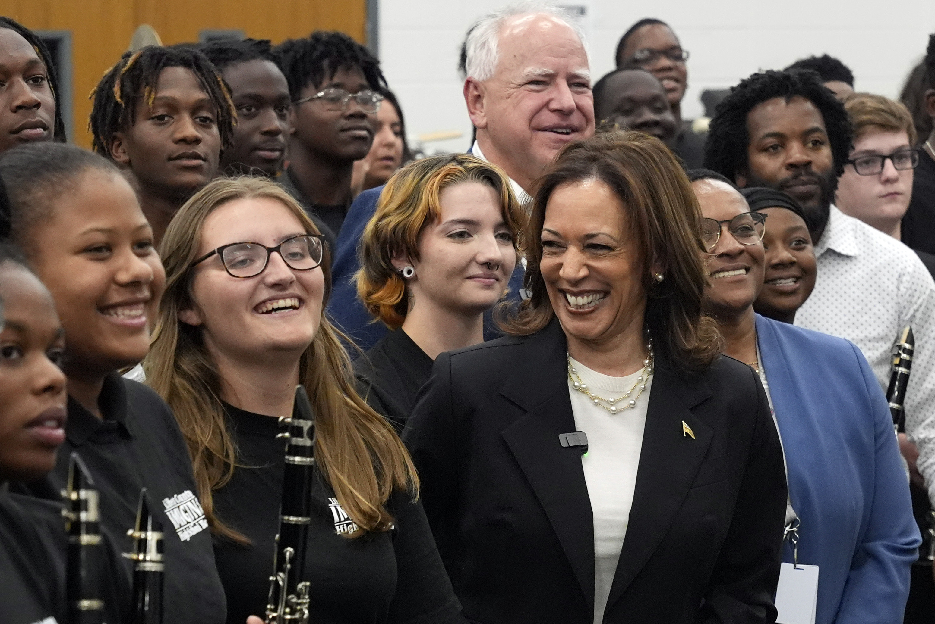 Democratic presidential nominee Vice President Kamala Harris and Democratic vice presidential candidate Minnesota Gov. Tim Walz pose for a photo with marching band members at Liberty County High School in Hinesville, Ga., Wednesday, Aug. 28, 2024.<br />(Jacquelyn Martin / AP Photo)