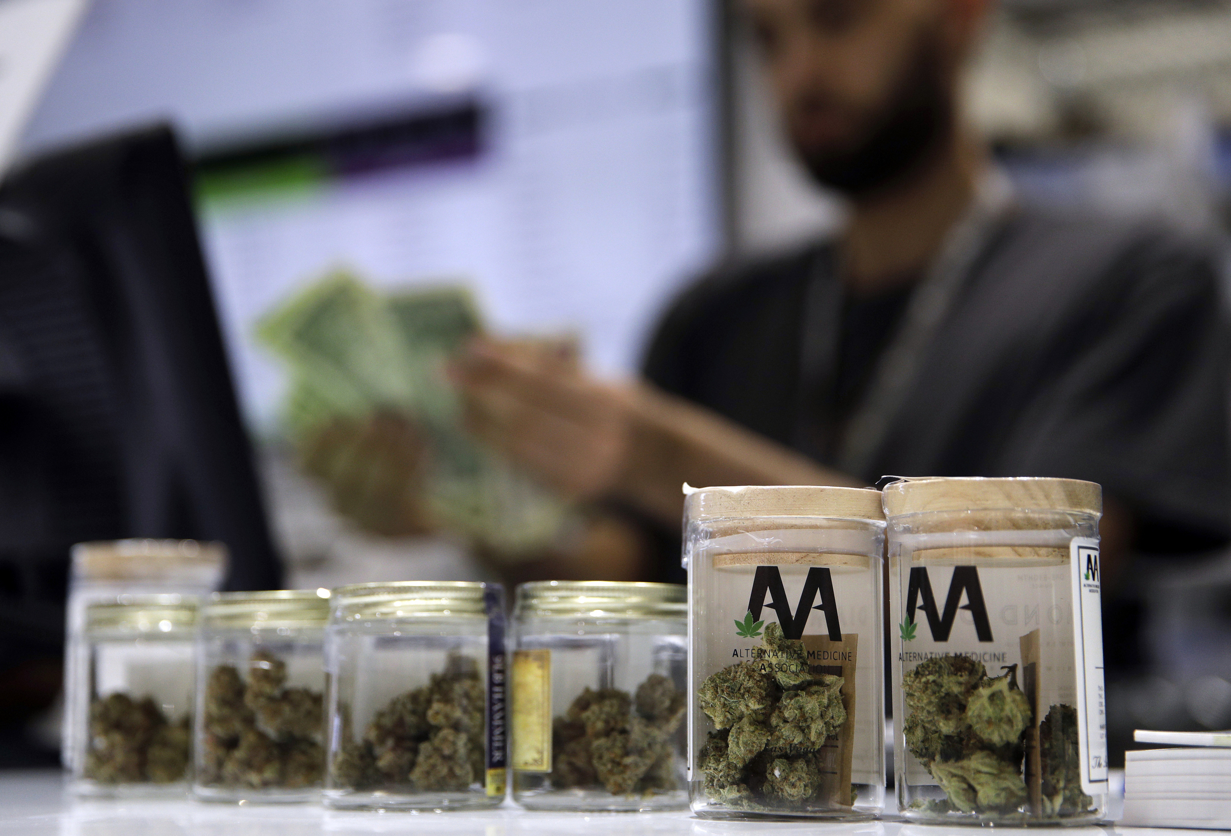 A cashier rings up a marijuana sale, July 1, 2017, at a cannabis dispensary in Las Vegas.<br />(John Locher / AP Photo)