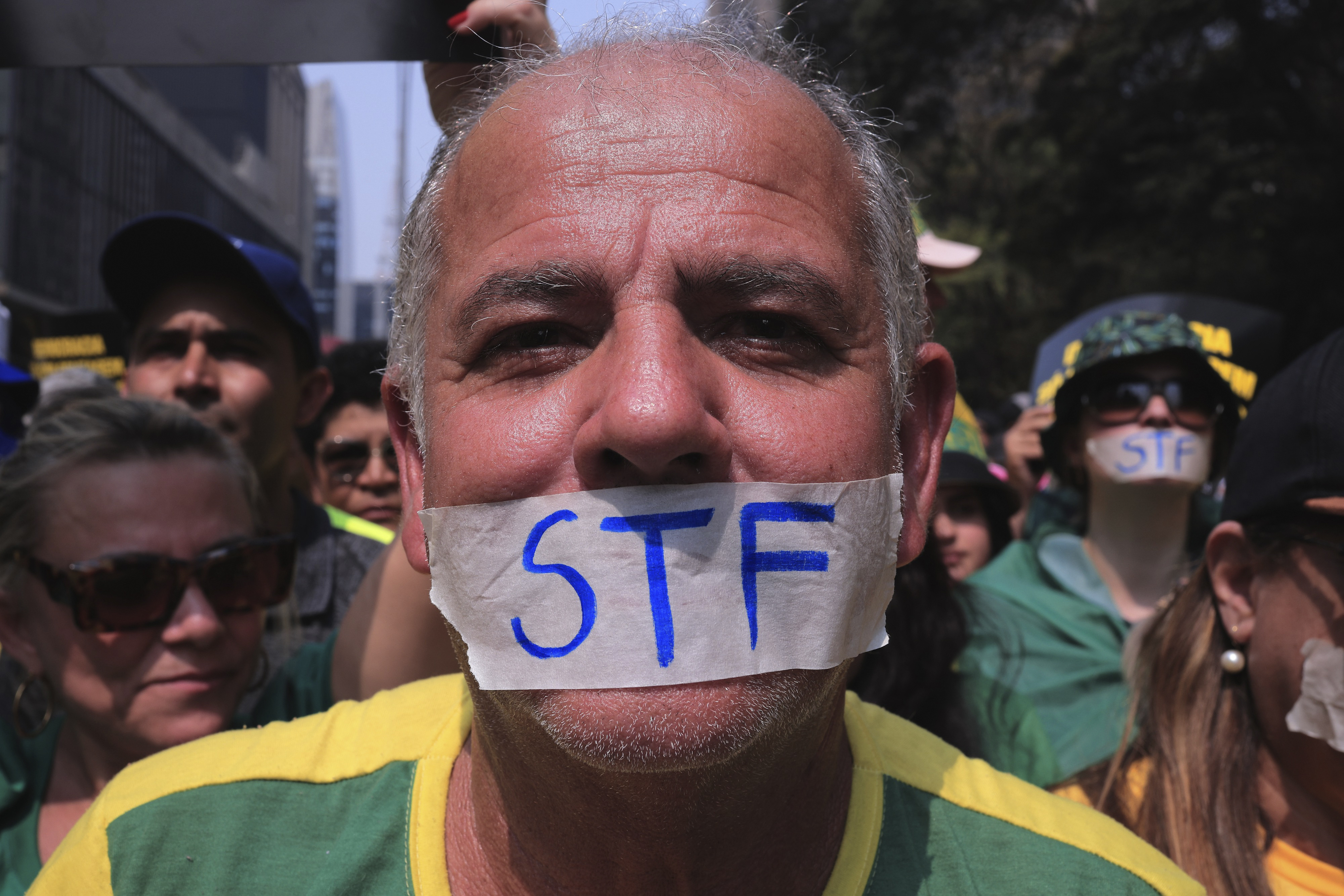 A demonstrator, his mouth covered with tape marked with the Brazilian Supreme Court acronym, takes part in a protest calling for the impeachment of Supreme Court Minister Alexandre de Moraes, who recently imposed a nationwide block on Elon Musk’s social media platform X, in Sao Paulo, Saturday, Sept. 7, 2024.<br />(Ettore Chiereguini / AP Photo)