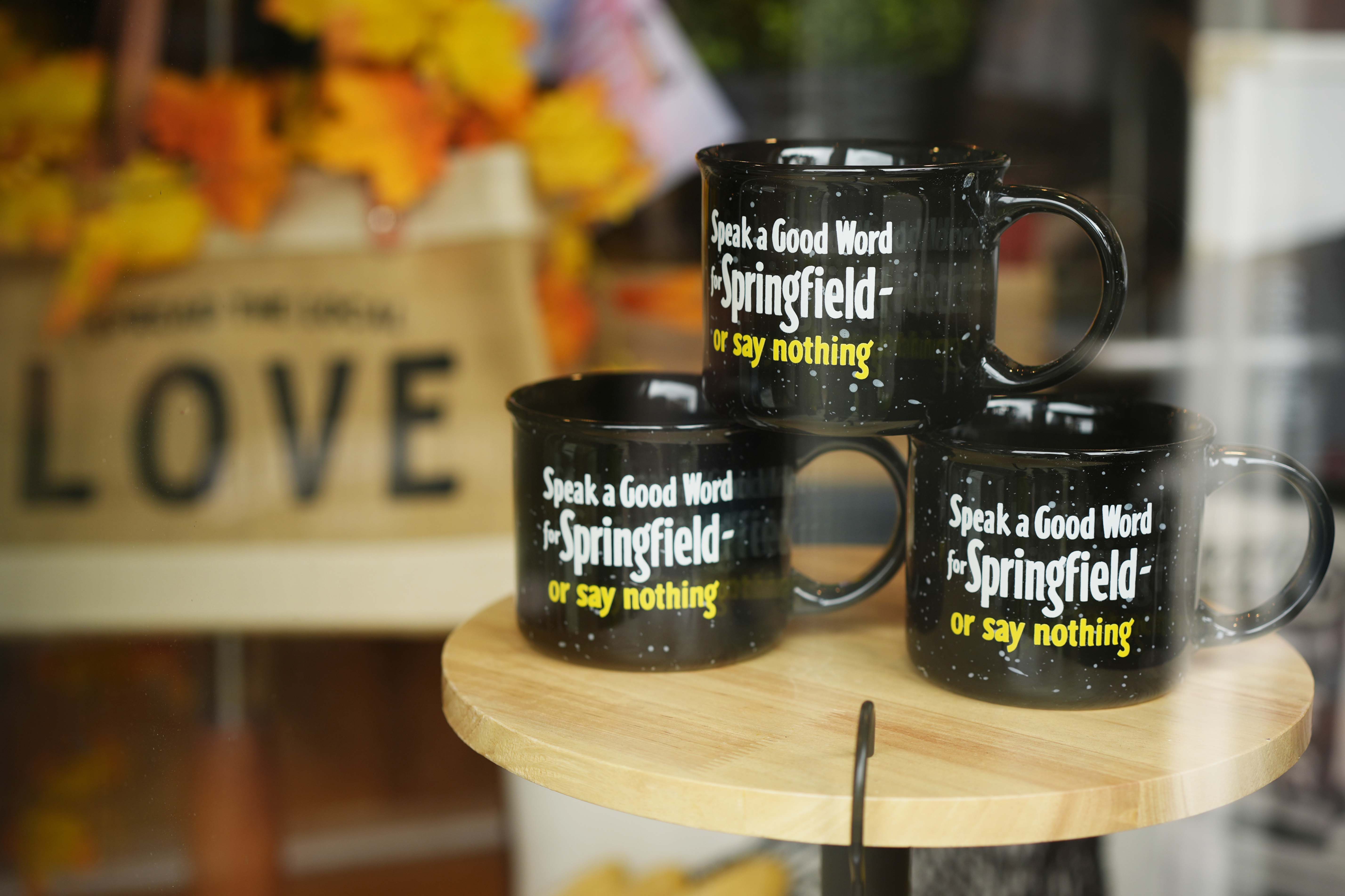 Mugs that read &quot;Speak a Good Word for Springfield or say nothing&quot; are displayed in the Champion City Guide &amp; Supply shop window on Tuesday, Sept. 17, 2024, in Springfield, Ohio.<br />(Carolyn Kaster / AP Photo)