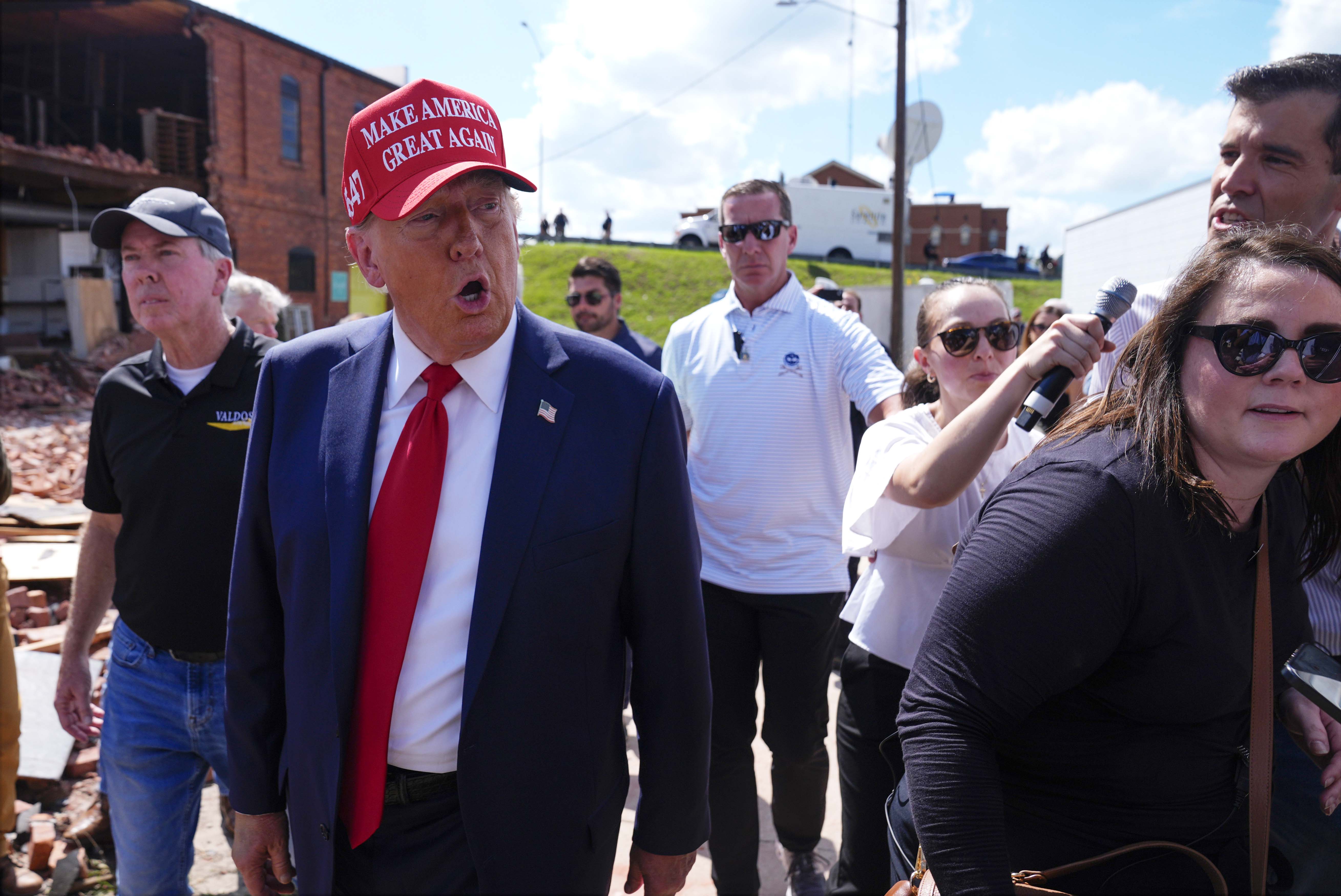 Republican presidential nominee former President Donald Trump walks outside the Chez What furniture store as he visits Valdosta, Ga., a town impacted by Hurricane Helene, Monday, Sept. 30, 2024.<br />(Evan Vucci / AP Photo)