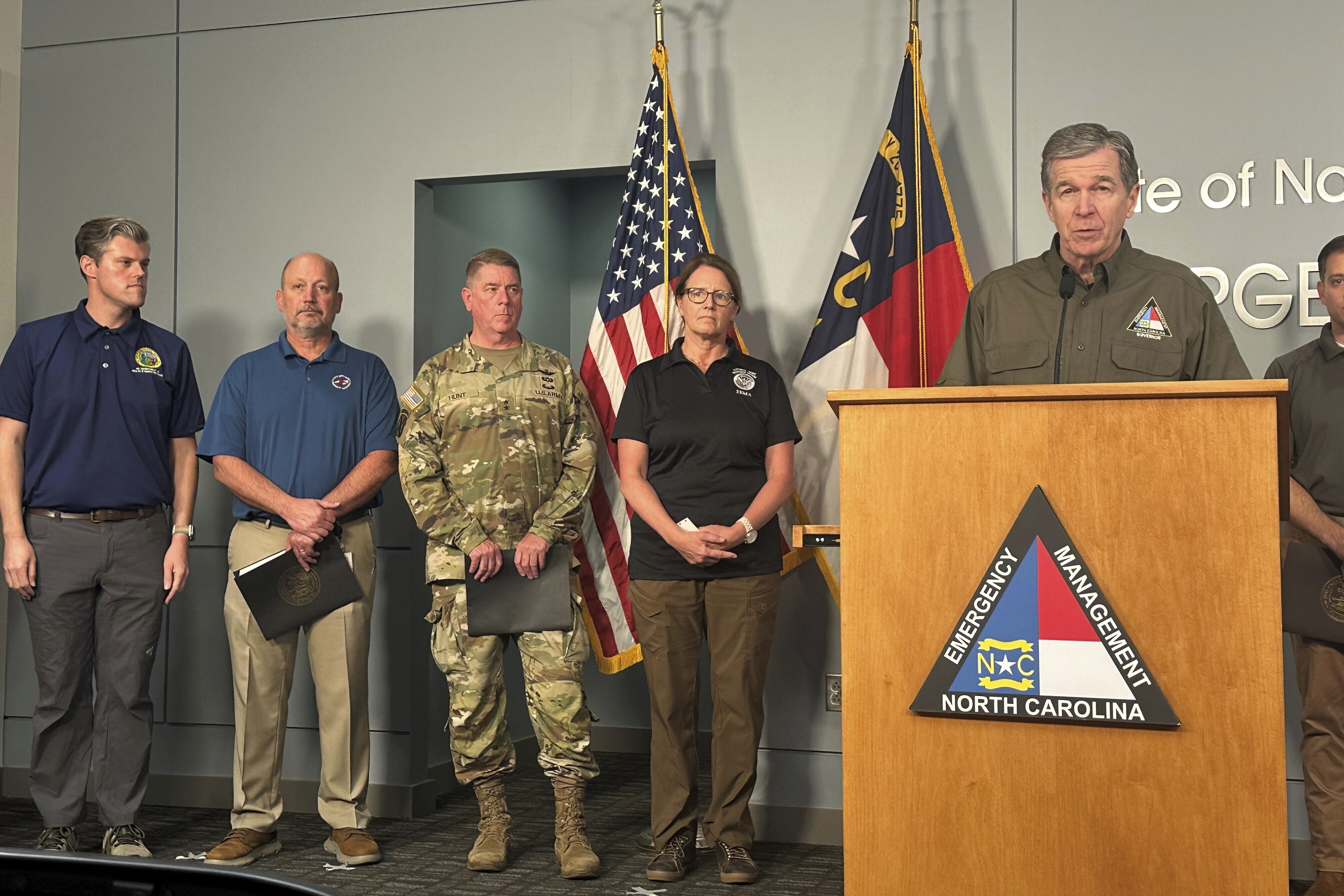 North Carolina Gov. Roy Cooper (at podium), speaks during a media briefing on the government response to Hurricane Helene in western North Carolina while Federal Emergency Management Agency Administrator Deanne Criswell (center) and others listen at the state Emergency Operations Center in Raleigh, N.C., Tuesday, Oct. 1, 2024.<br />(Gary D. Robertson / AP Photo)