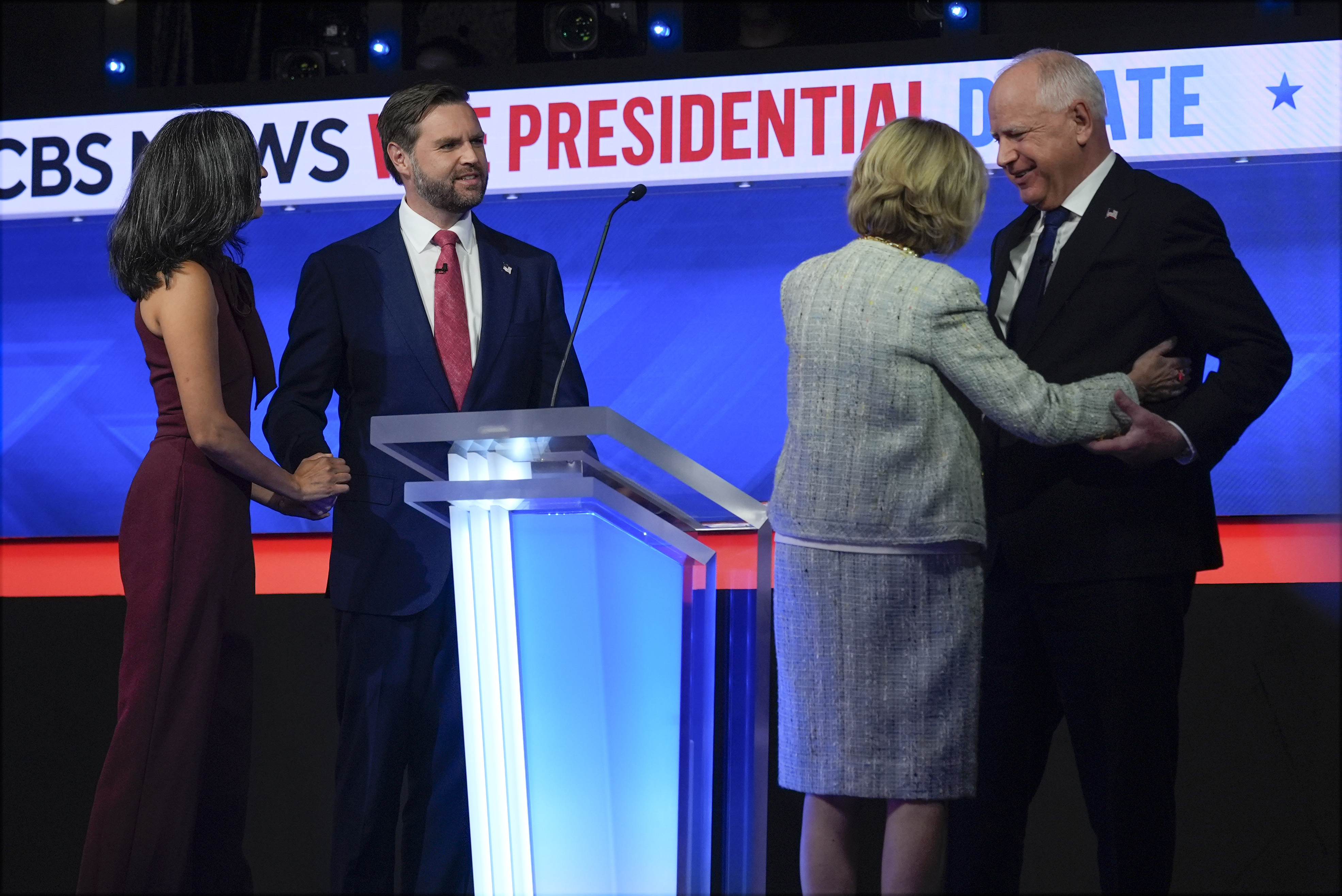 Republican vice presidential nominee Sen. JD Vance, R-Ohio, and his wife Usha Vance and and Democratic vice presidential candidate Minnesota Gov. Tim Walz and his wife Gwen Walz stand on stage after the vice presidential debate hosted by CBS News, Tuesday, Oct. 1, 2024, in New York.<br />(Matt Rourke / AP Photo)