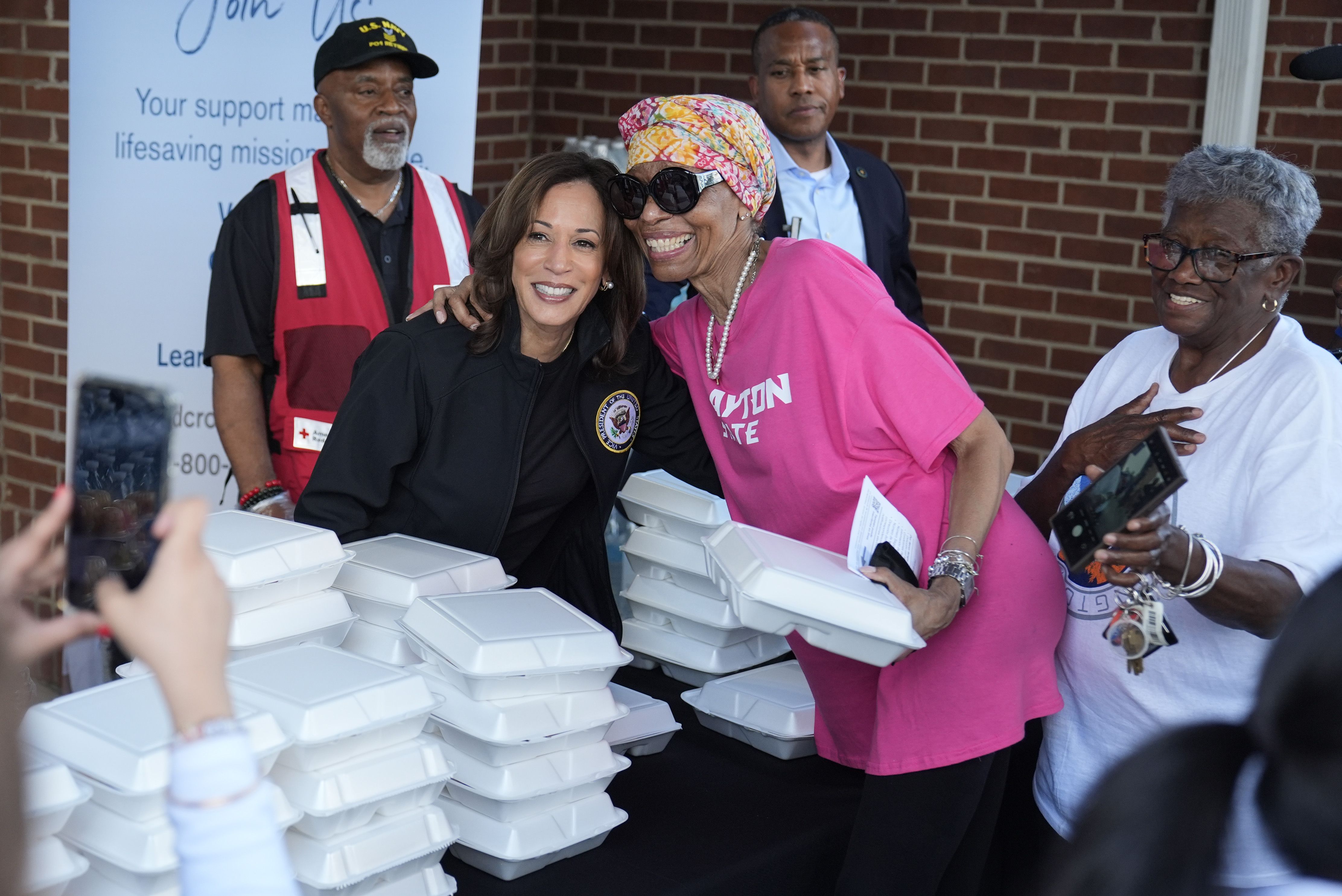Democratic presidential nominee Vice President Kamala Harris poses for a photo as she helps distribute food with the American Red Cross at the Henry Brigham Community Center in Augusta, Ga., Wednesday, Oct. 2, 2024.<br />(Carolyn Kaster / AP Photo)