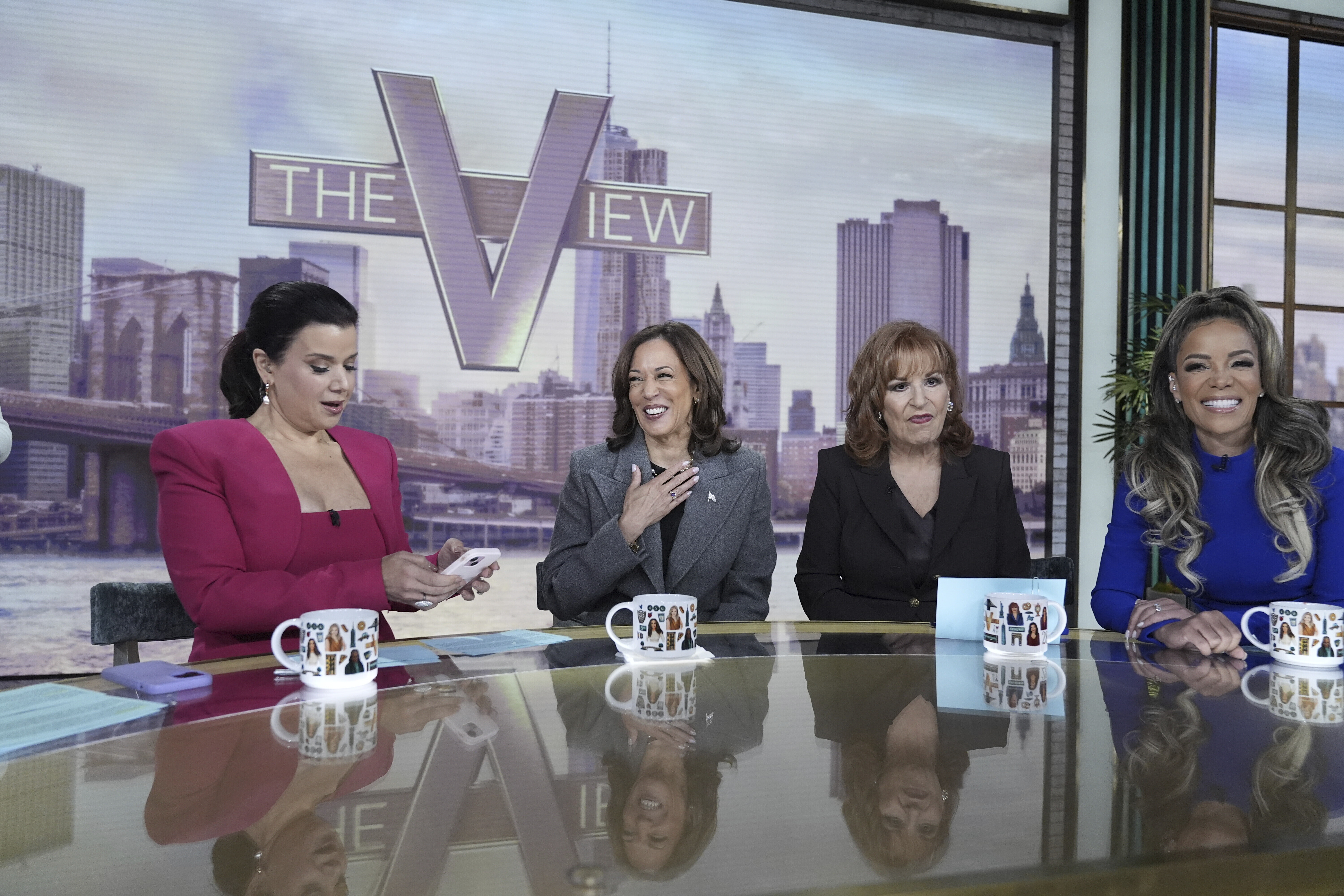 Democratic presidential nominee Vice President Kamala Harris chats with the hosts during a commercial break at The View, Tuesday, Oct. 8, 2024, in New York. From left are Ana Navarro, Harris, Joy Behar and Sunny Hostin.<br />(Jacquelyn Martin / AP Photo)