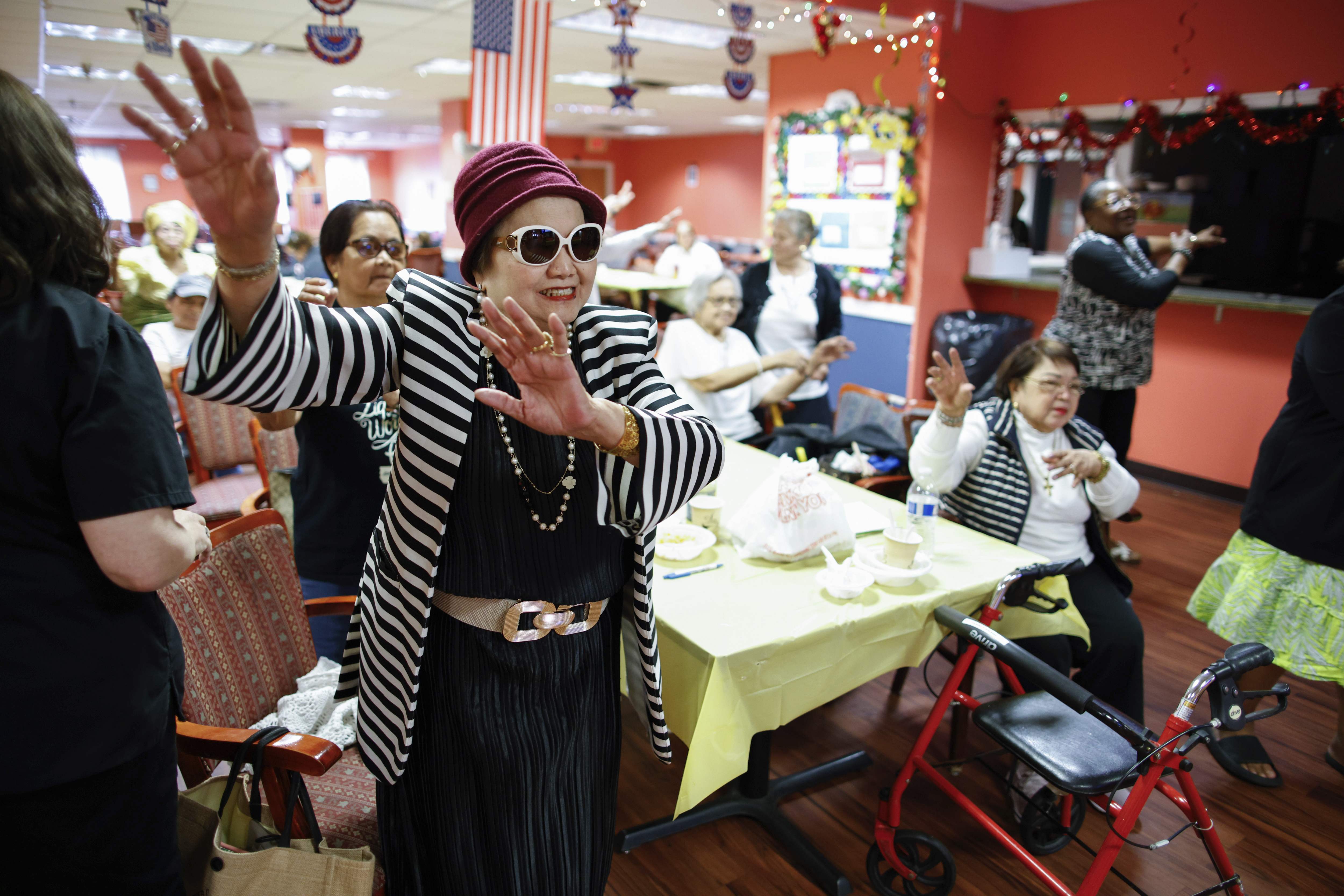 People attend a Zumba exercise class at Sunshine Adult Day Center in Bergenfield, N.J., Monday, Aug. 26, 2024.<br />(Kena Betancur / AP Photo)