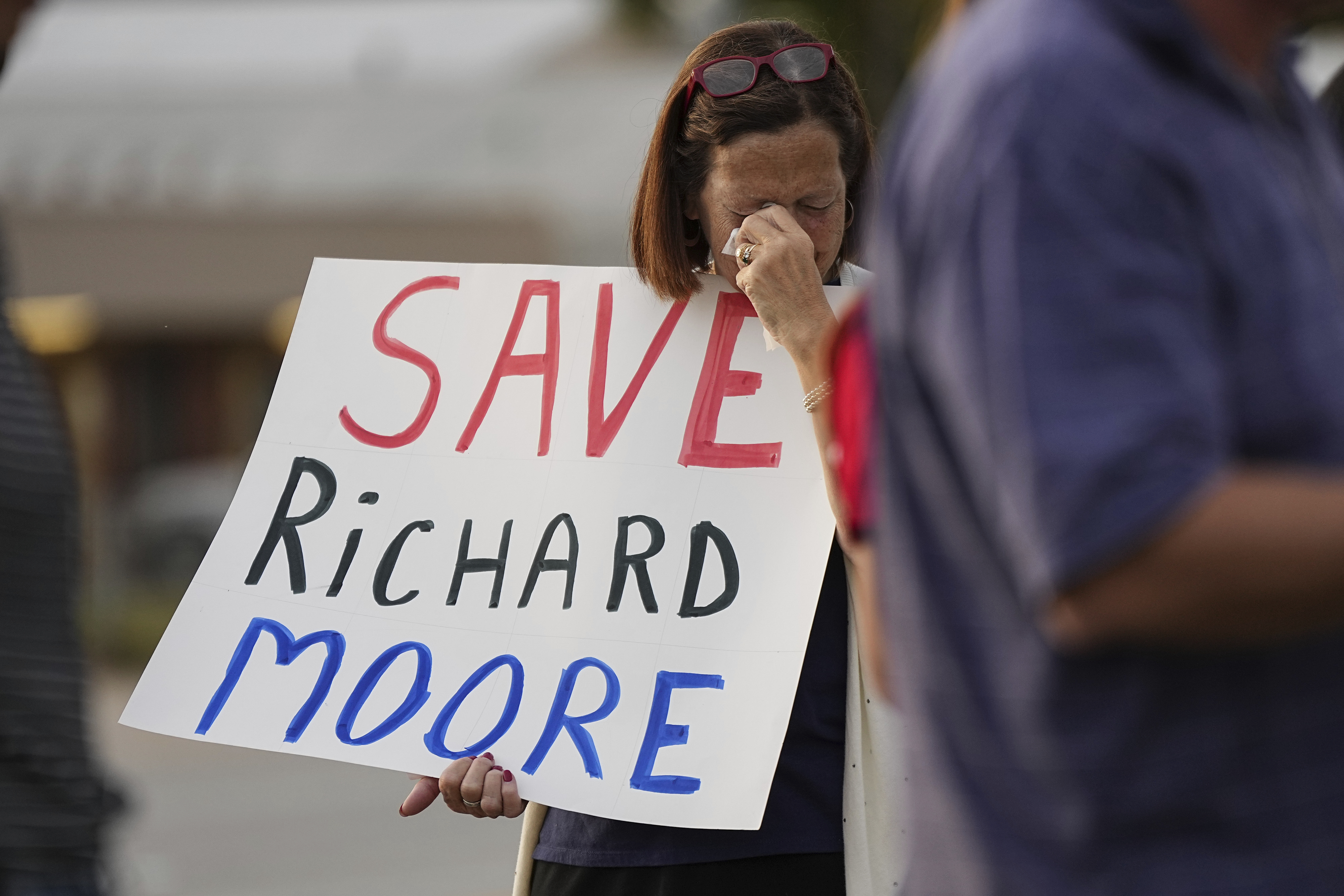 A protestor weeps prior to the scheduled execution of Richard Moore outside of Broad River Correctional Institution, Friday, Nov. 1, 2024, in Columbia , S.C.<br /> (Matt Kelley / AP Photo)