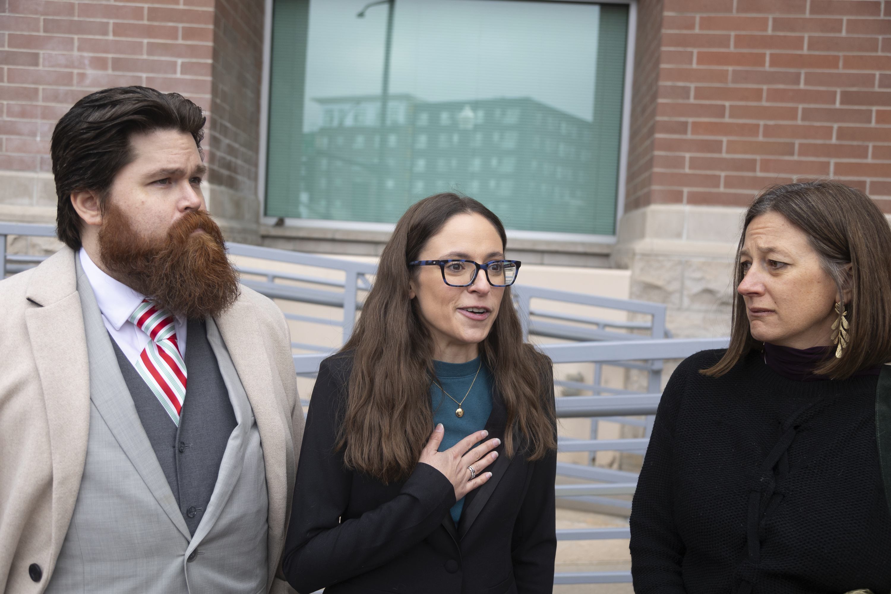 Left to right: John Adkins and his wife Jennifer, along with family physician Julie Lyons, talk to the media outside the Ada County Courthouse, Dec. 14, 2023, in Boise, Idaho.<br />(Kyle Green / AP Photo)