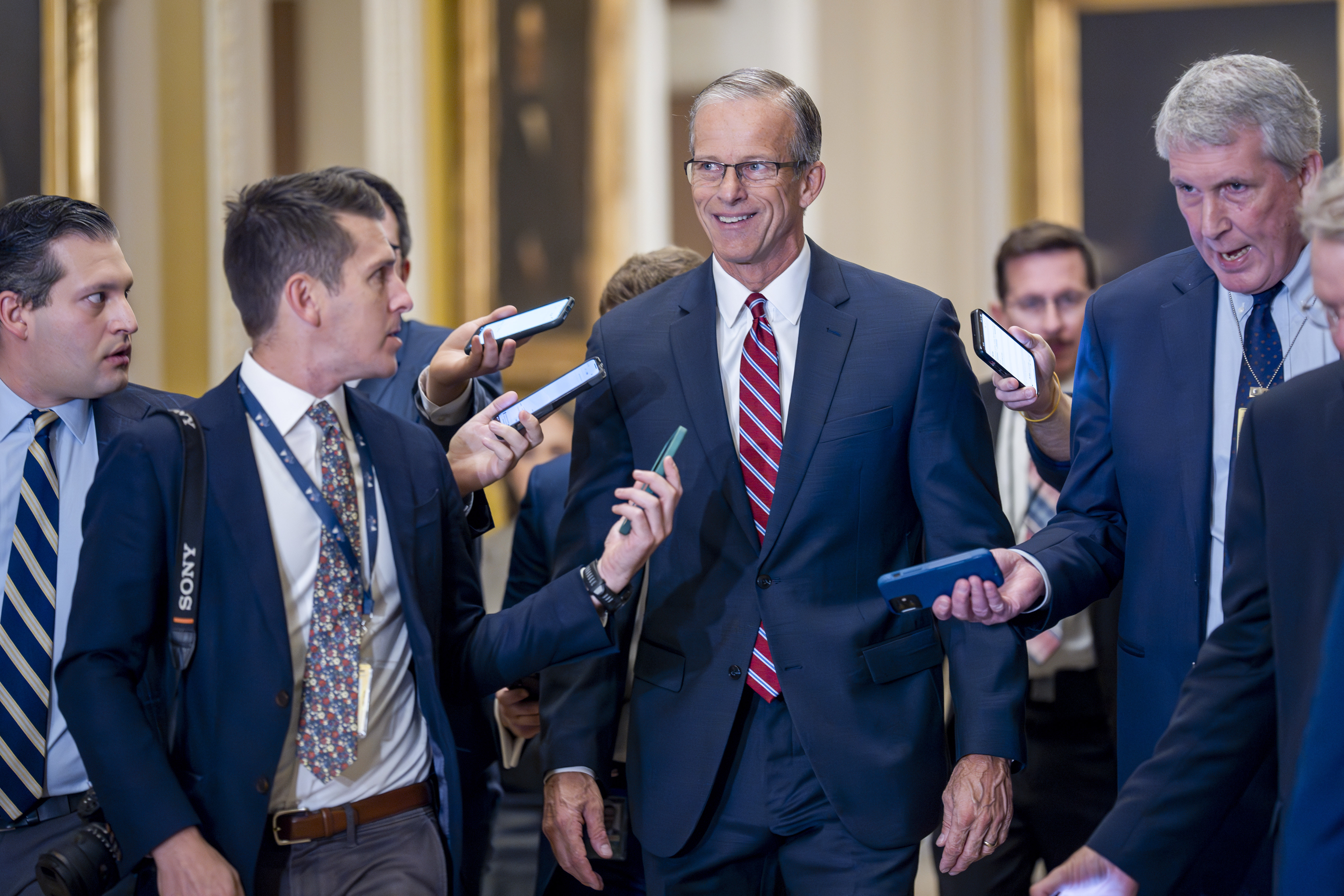 Senate Minority Whip John Thune, R-S.D., walks with reporters on the way to being elected to succeed longtime GOP leader Mitch McConnell of Kentucky, at the Capitol in Washington, Wednesday, Nov. 13, 2024.<br />(AP Photo)