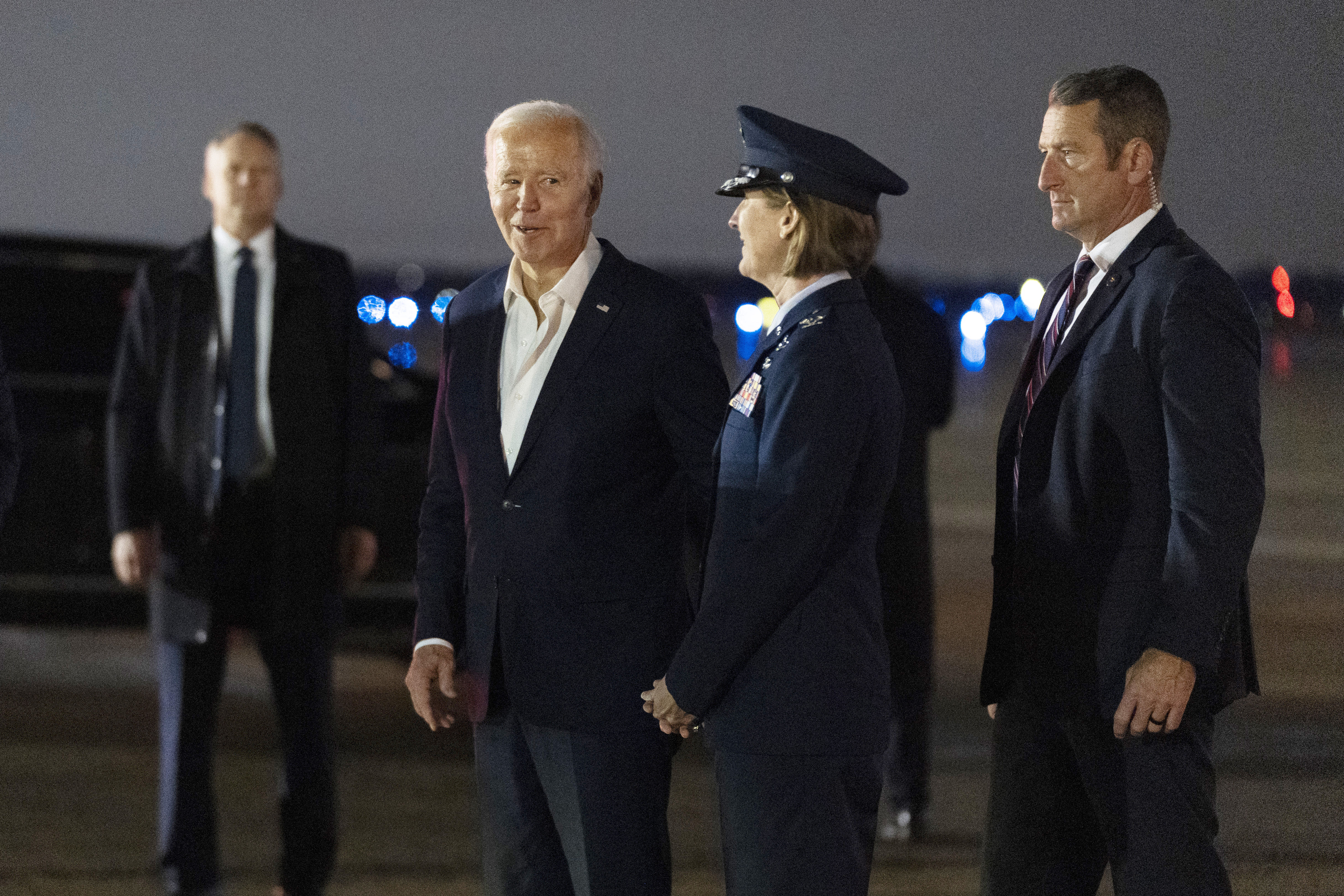 President Joe Biden  is greeted by Col. Angela Ochoa, Commander, 89th Airlift Wing (second from right) as he arrives on Air Force One late Tuesday, Nov. 19 2024, at Joint Base Andrews, from G20 Summit in Rio de Janeiro.<br />(Manuel Balce Ceneta / AP Photo)