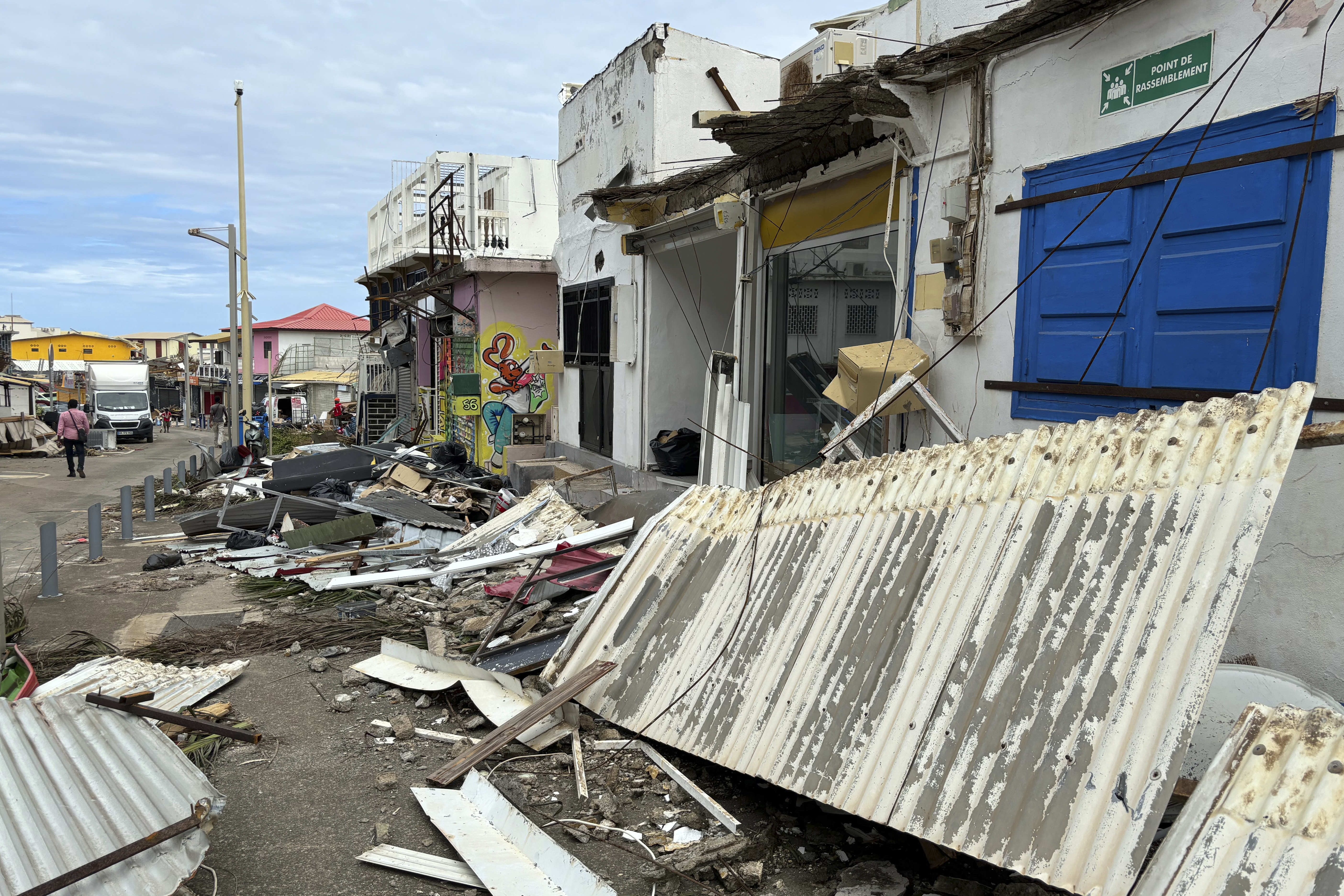 Debris are seen in a street of Mamoudzou, in the French Indian Ocean territory of Mayotte, Monday, Dec.16, 2024 and France uses ships and military aircraft to rush rescue workers and supplies after the island group was battered by its worst cyclone in nearly a century.<br />(Rainat Aliloiffa / AP Photo)