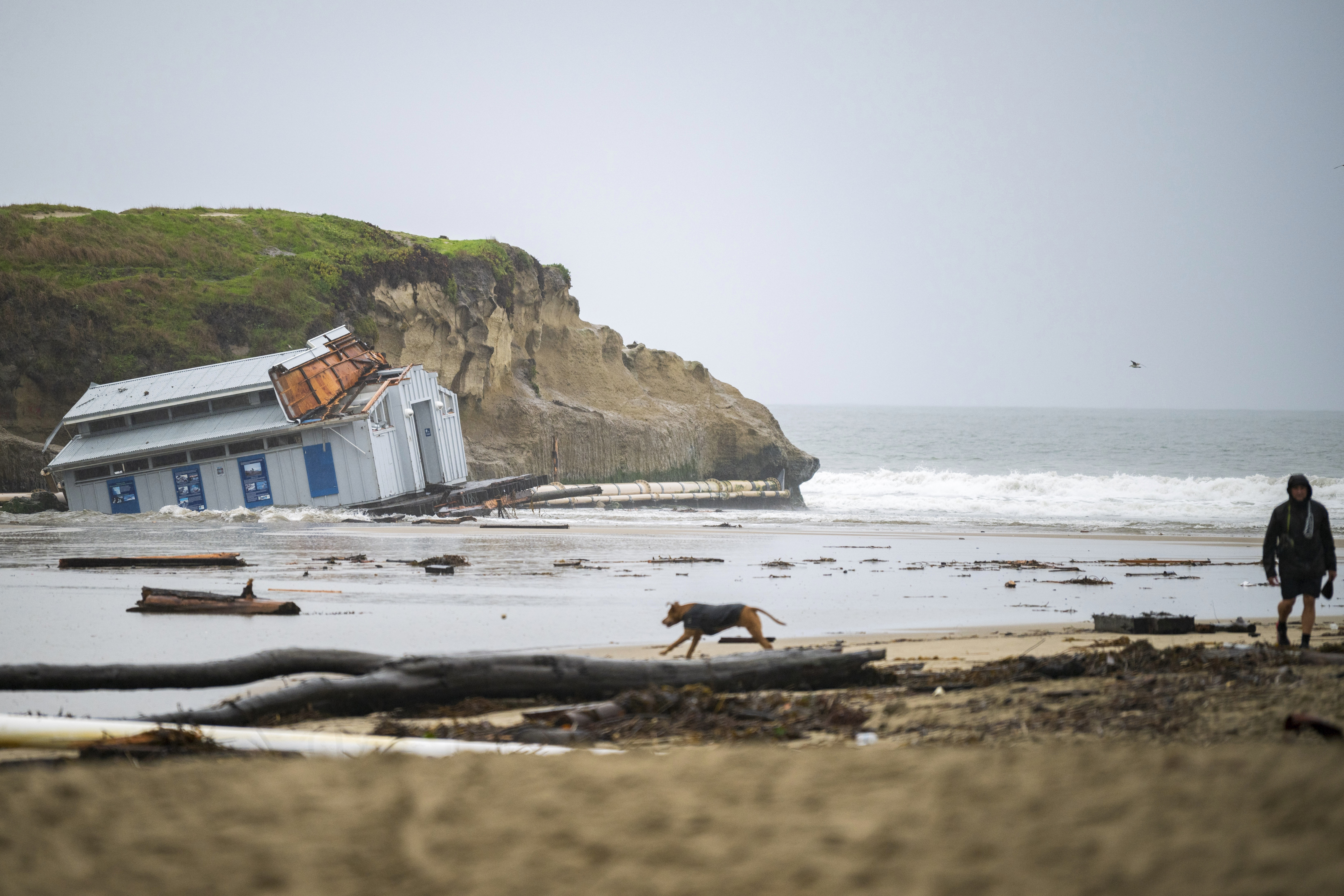 Remnants of a bathroom that fell off the wharf are visible at the mouth of the San Lorenzo River in Santa Cruz, Calif., Tuesday, Dec. 24, 2024.<br />(Nic Coury / AP Photo)