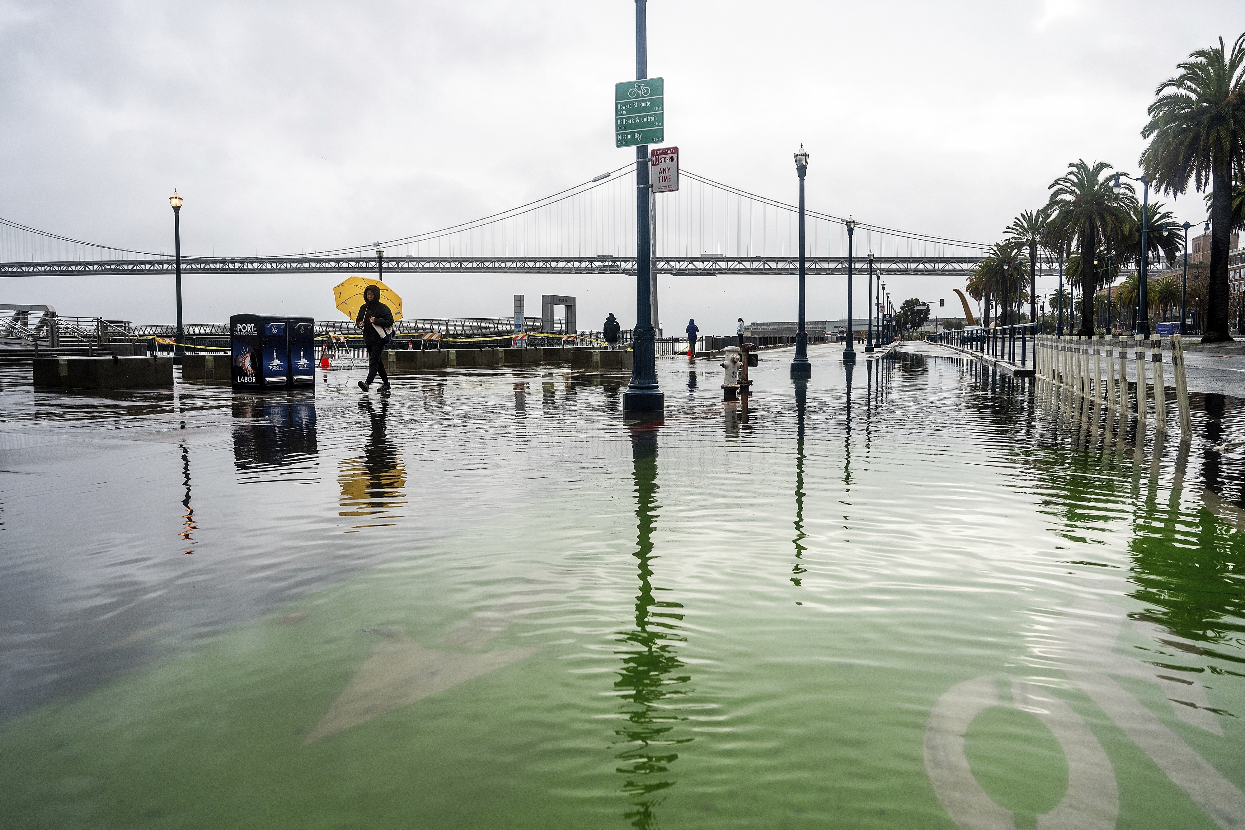 Water from the San Francisco Bay spills onto the Embarcadero as a result of high tides and storm-driven waves Dec. 14, 2024, in San Francisco.<br />(Noah Berger / AP Photo)