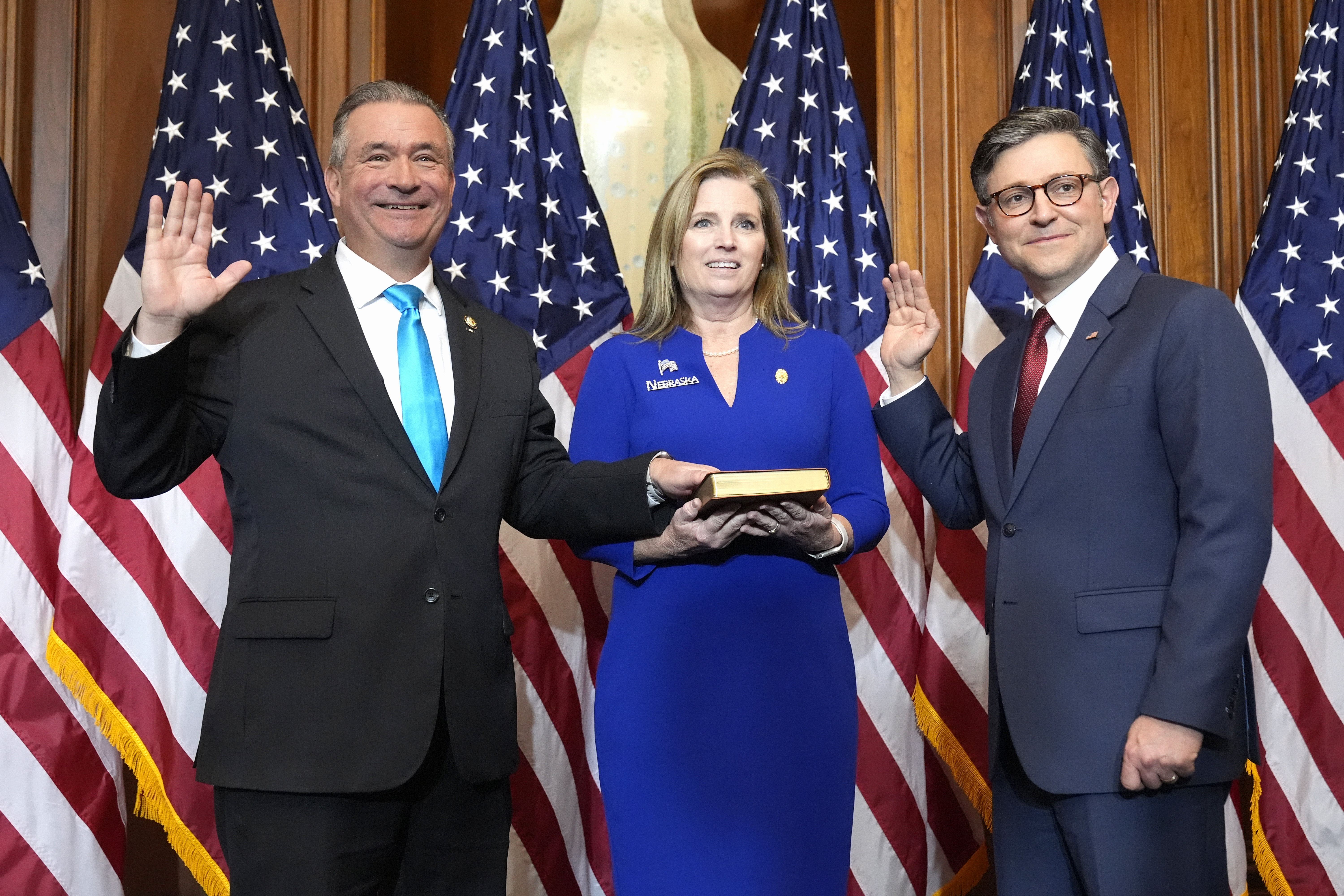 House Speaker Mike Johnson, R-La. (right) poses during a ceremonial swearing-in with Rep. Don Bacon, R-Neb. (left) in the Rayburn Room at the Capitol in Washington, Friday, Jan. 3, 2025.<br />(Mark Schiefelbein / AP Photo)