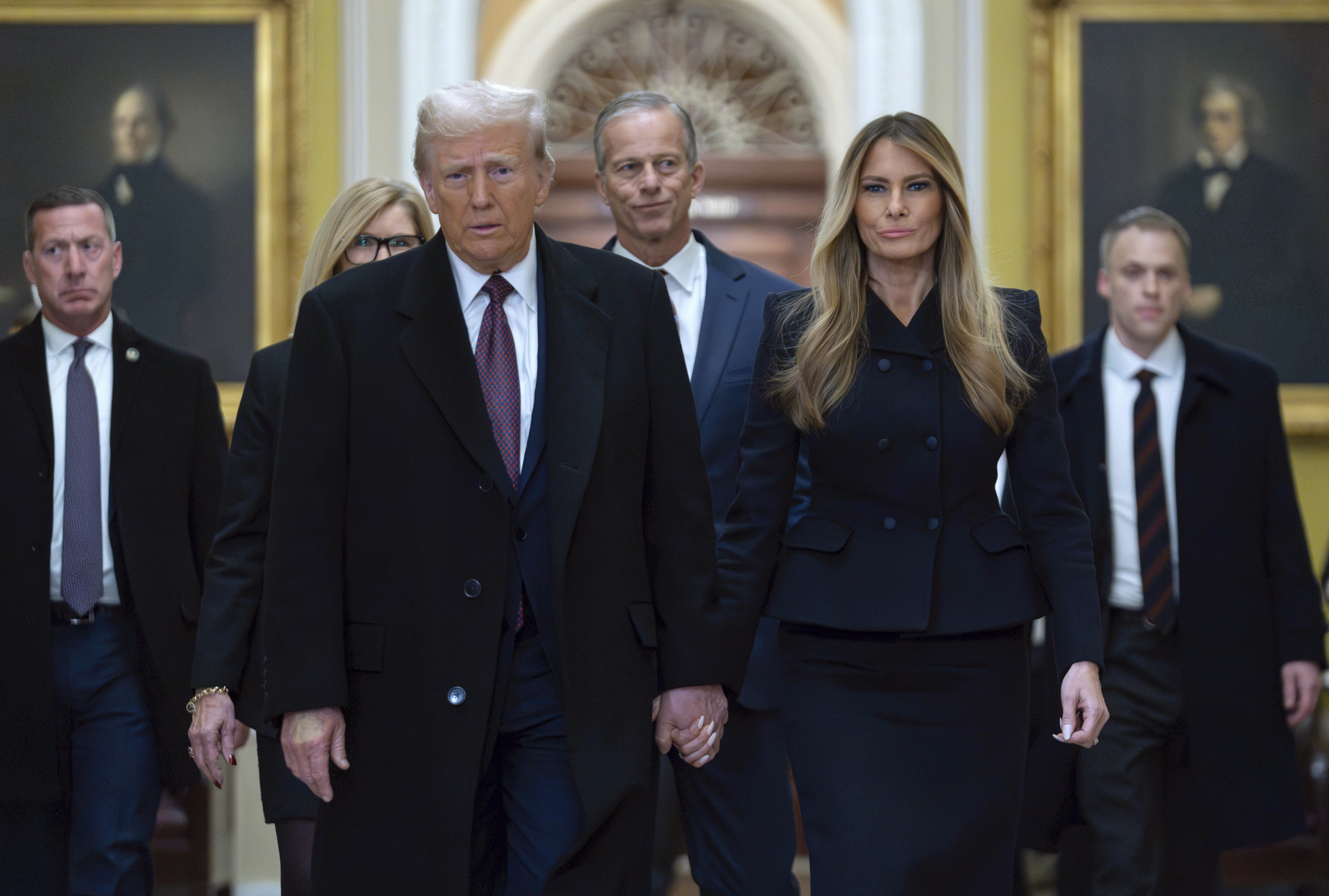 President-elect Donald Trump walks with Melania Trump at the Capitol, Wednesday, Jan. 8, 2025, in Washington, followed by Senate Majority Leader John Thune, R-S.D.<br /> (Jose Luis Magana / AP Photo)
