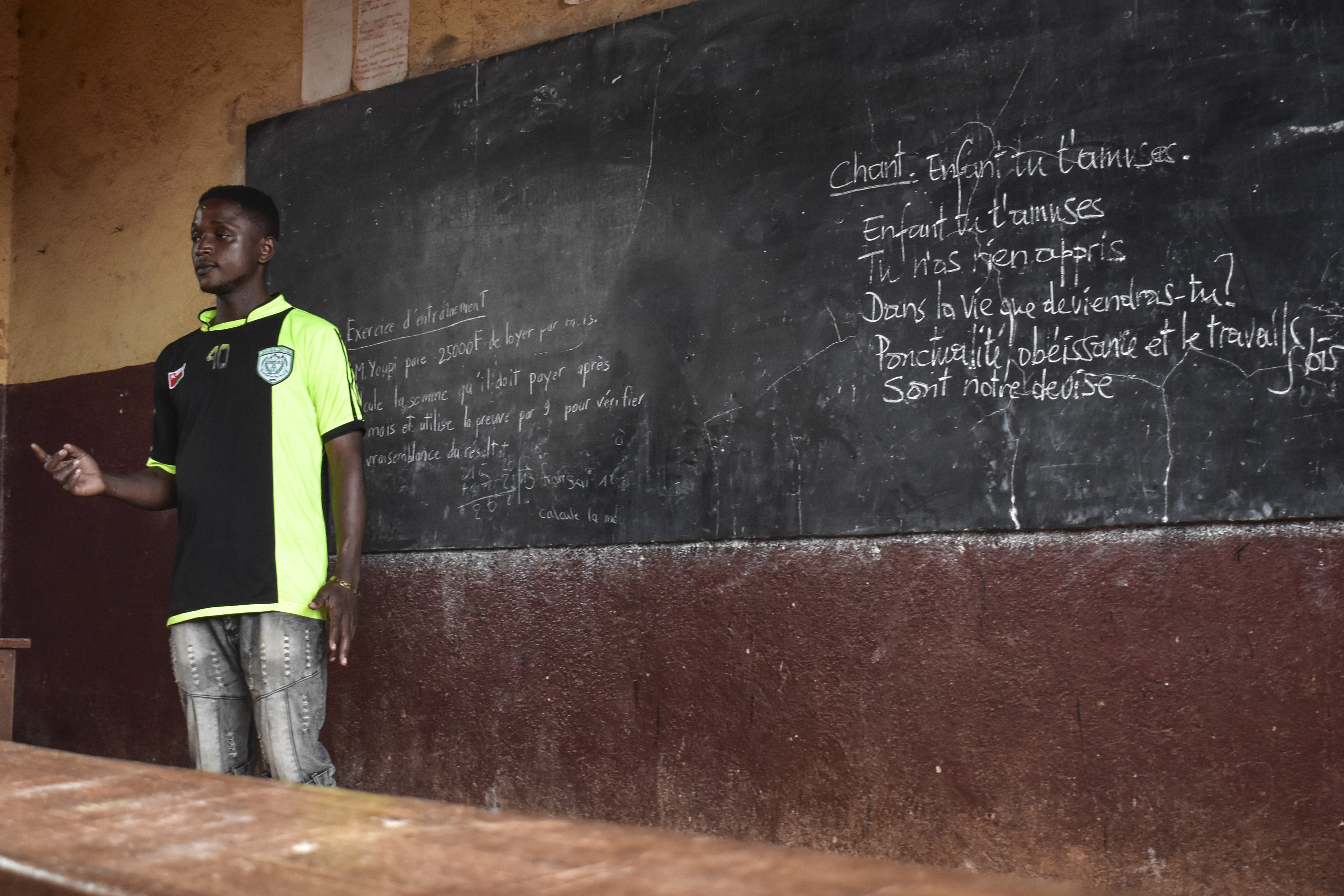 Ateasong Belts Tajoah gives a philosophy lesson to his students in Dschang, Cameroon, Friday, Dec. 1, 2024.<br />(Robert Bociaga / AP Photo)