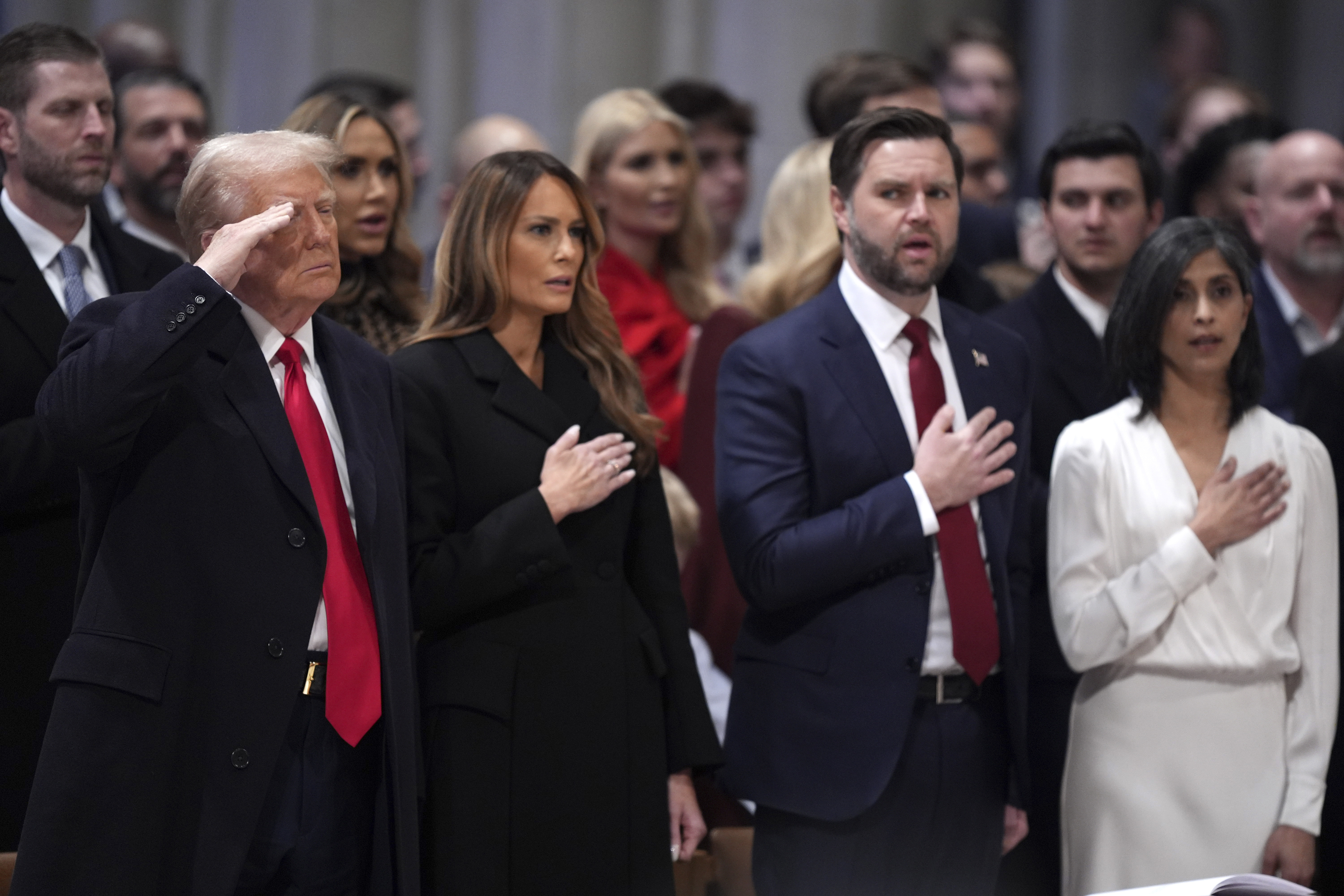 President Donald Trump (from left) salutes alongside first lady Melania Trump, Vice President JD Vance and his wife Usha Vance during the national prayer service at the Washington National Cathedral, Tuesday, Jan. 21, 2025, in Washington.<br />(Evan Vucci / AP Photo)