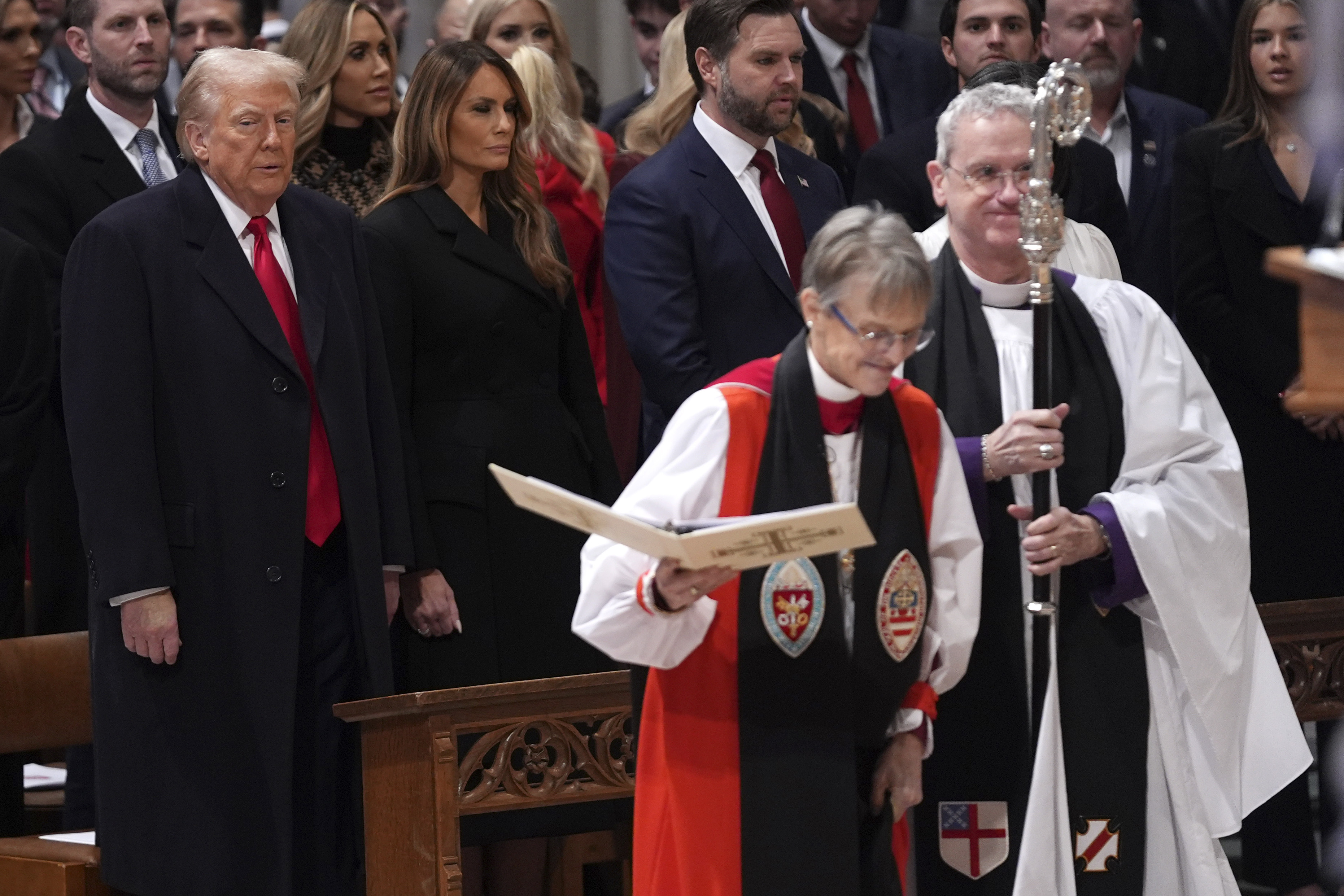 President Donald Trump (left) watches as Rev. Mariann Budde (second from right) arrives at the national prayer service at the Washington National Cathedral, Tuesday, Jan. 21, 2025, in Washington.<br /> (Evan Vucci / AP Photo)